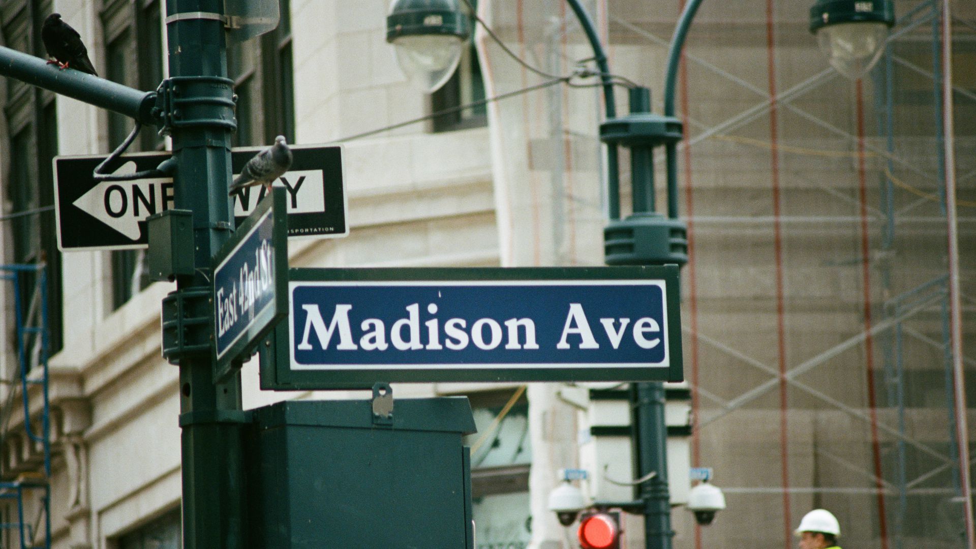 In this image, the street sign for Madison Avenue in New York is visible. 