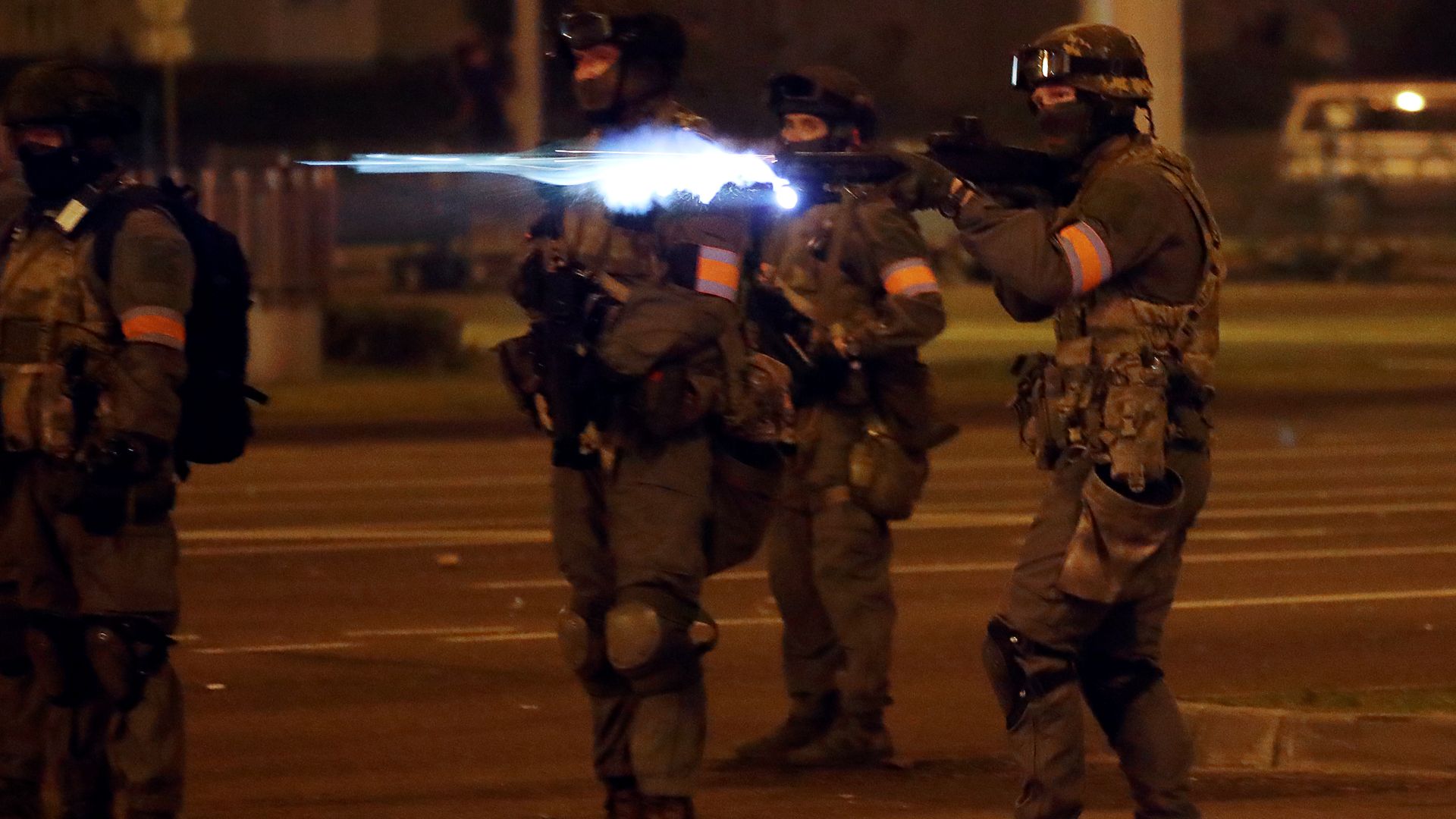 Law enforcement officers guard a street during a protest against the results of the 2020 Belarusian presidential election.