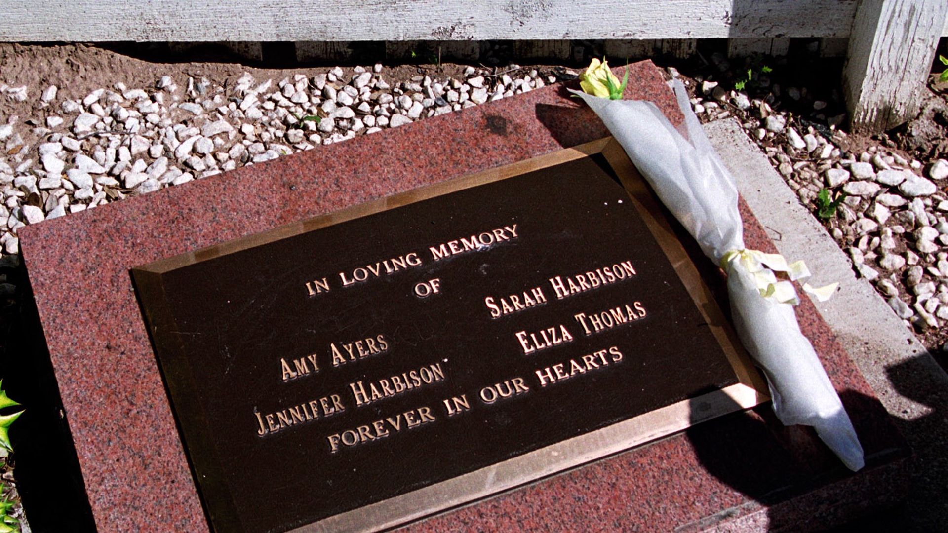A plaque dedicated to victims of the yogurt shop murders.