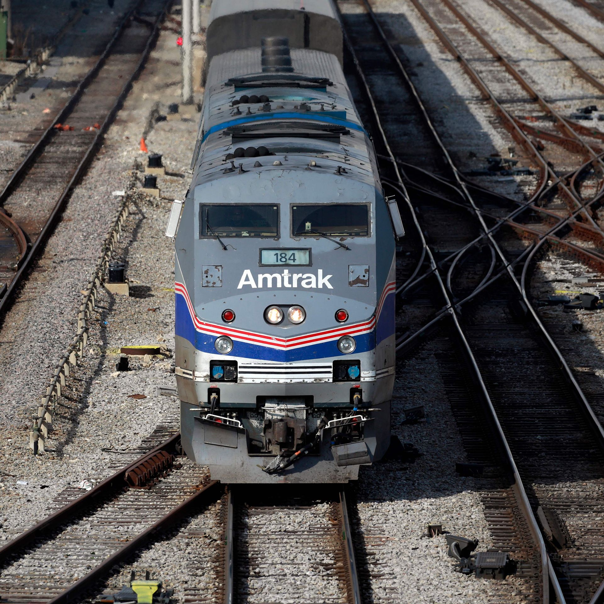 An Amtrak train departing a station. 