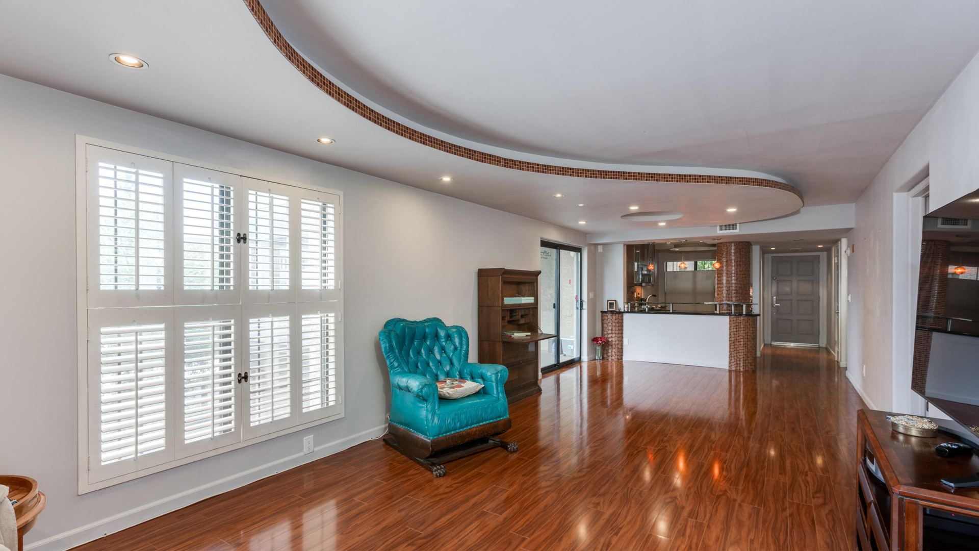 A living room with a curved roof. 