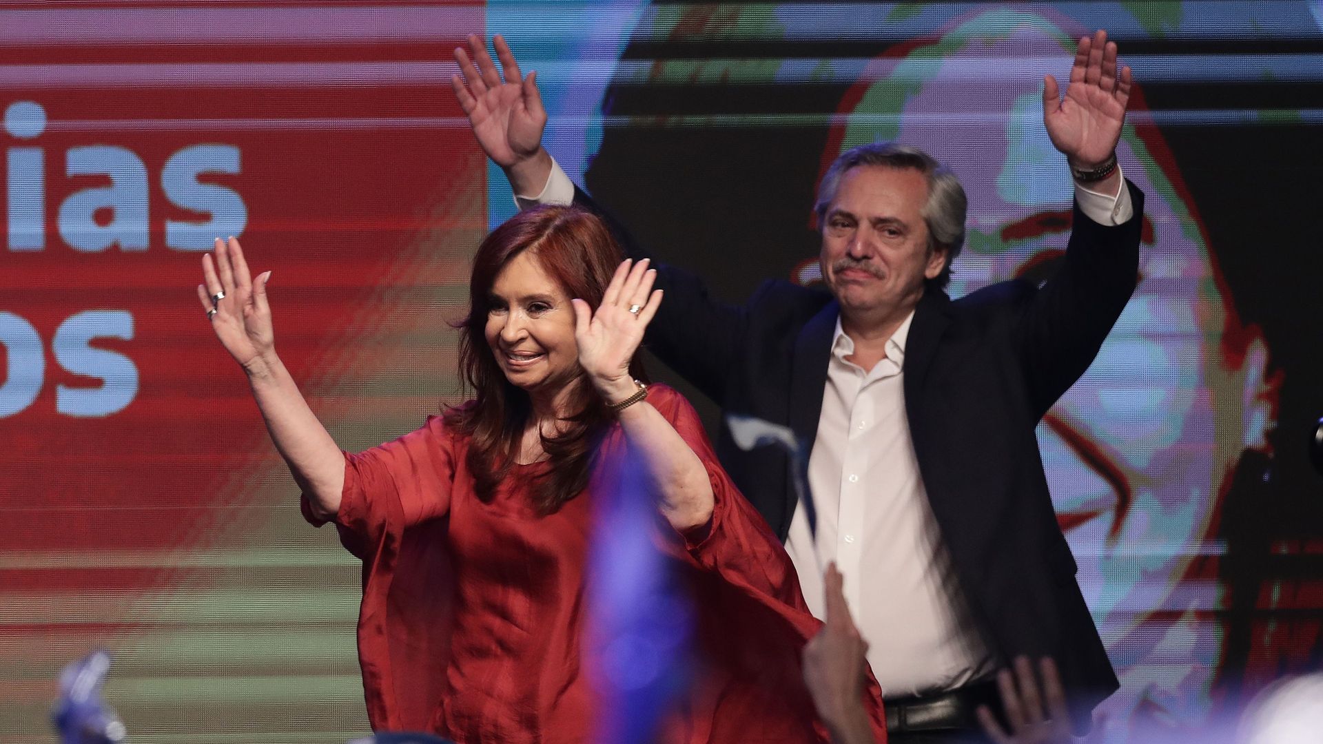 Argentina's president elect Alberto Fernandez and vice-president Cristina Fernandez wave at supporters at the headquarters of the party in Buenos Aires on October 27
