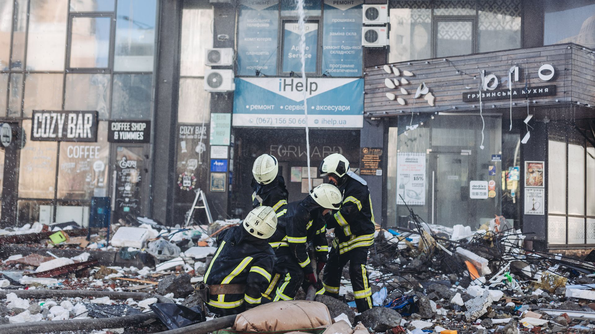 Firefighters try to extinguish a fire from a bombed civilian building in a residential area on February 26, 2022, in Kiev, Ukraine.
