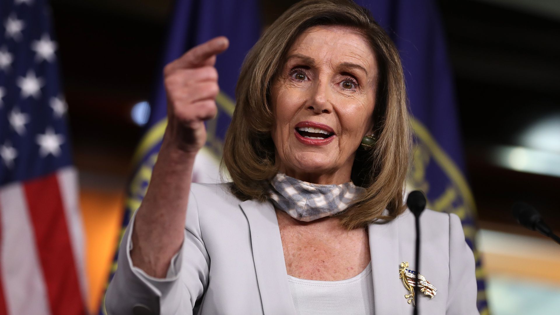 Nancy Pelosi at the podium