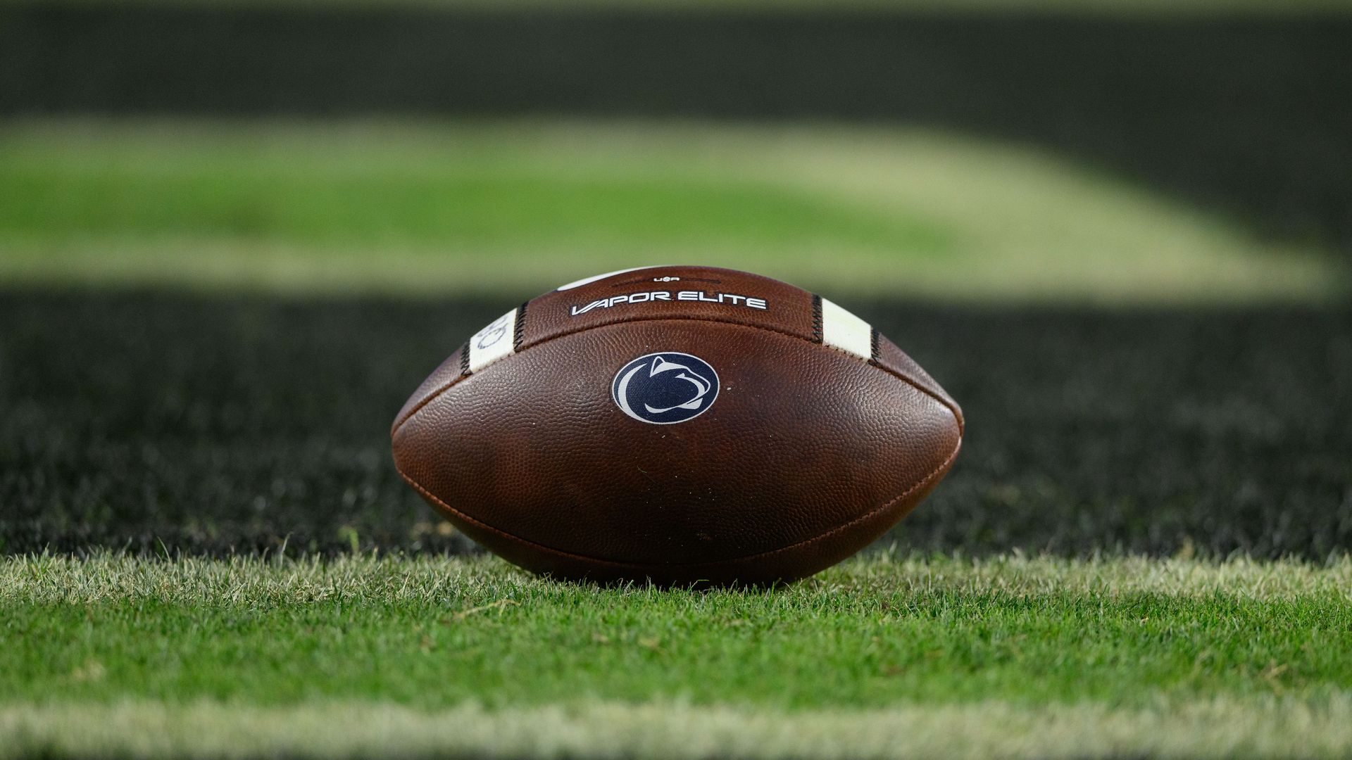 A football with the Penn State logo at midfield during one of the Nittany Lions' games.