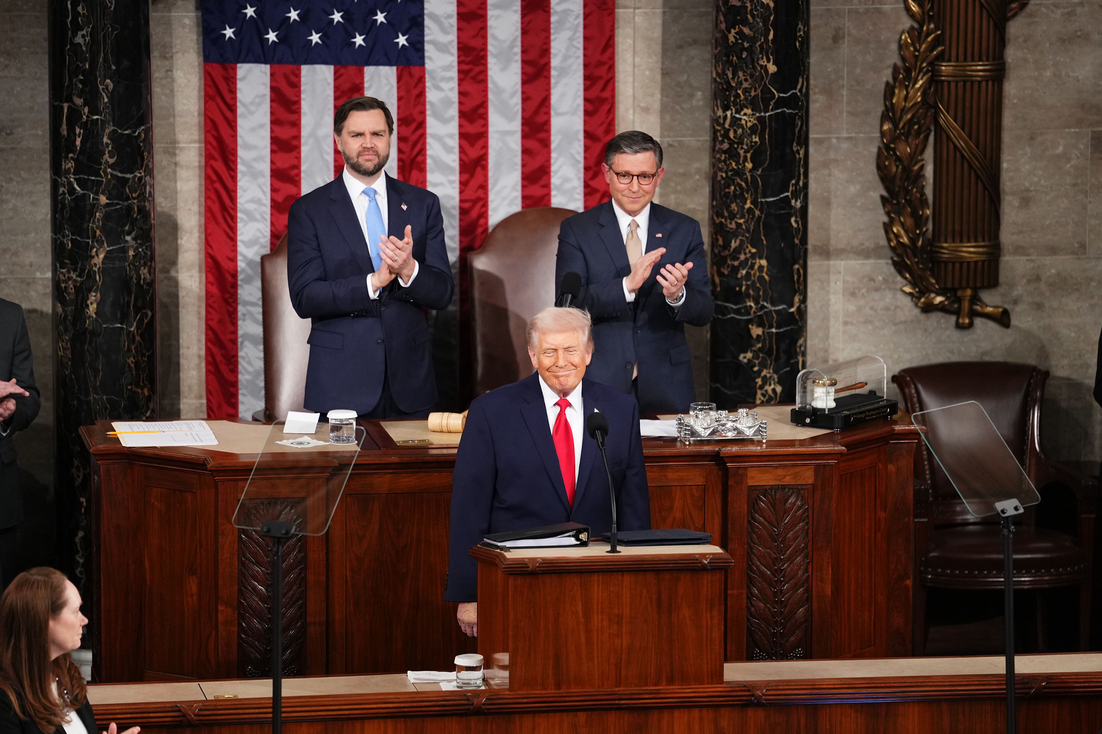 Vice President JD Vance and House Speaker Mike Johnson (R-La.) applaud as President Trump arrives. Photo: Eric Lee/The New York Times