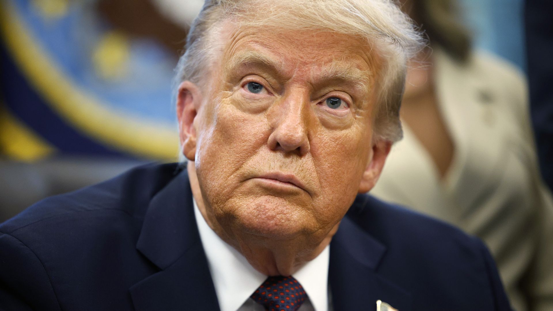 President Trump answers questions from reporters in the Oval Office 
