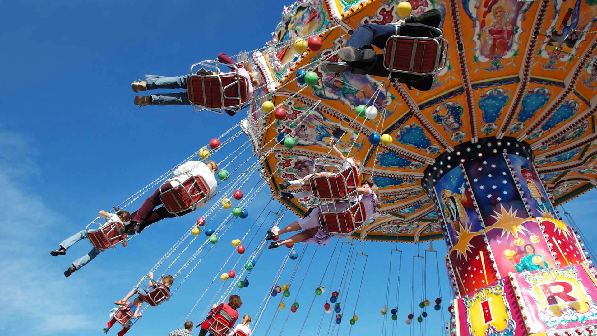 People on a swing ride at an amusement park