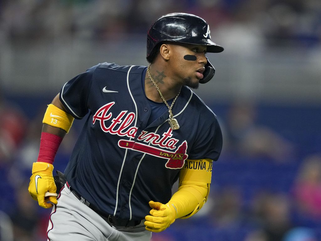 Eddie Rosario of the Atlanta Braves gives high fives after winning News  Photo - Getty Images