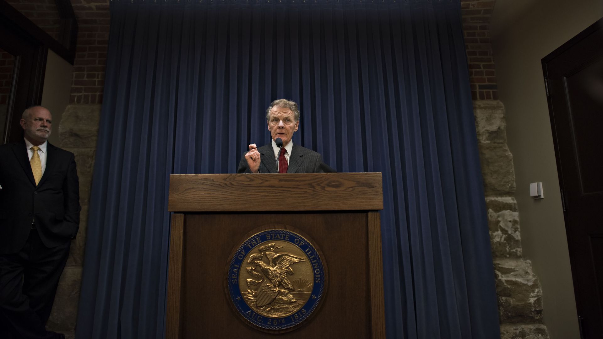 Photo of a man behind a podium. 