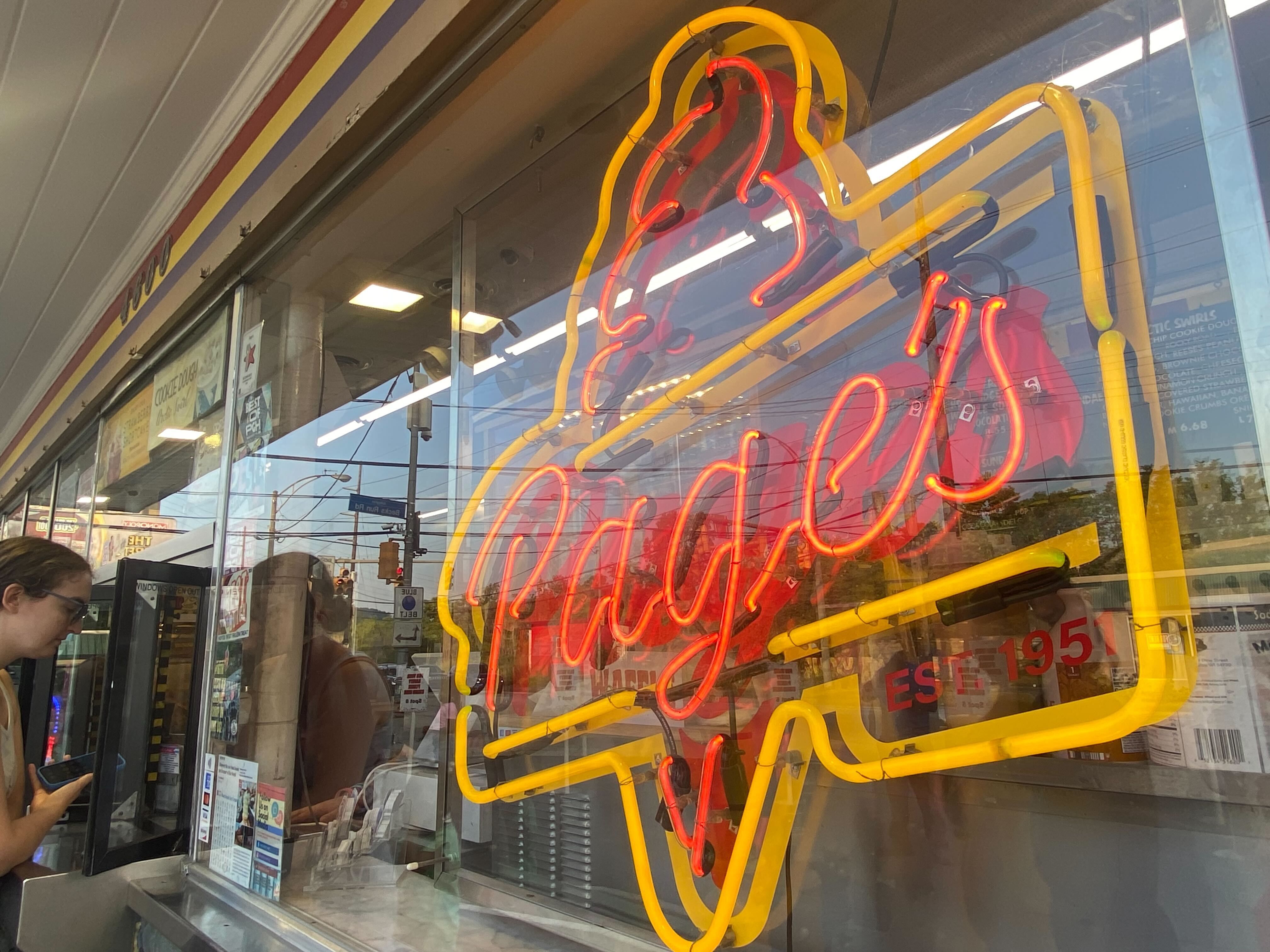 Page's Dairy Mart ice cream stand in Pittsburgh with a neon red and yellow sign