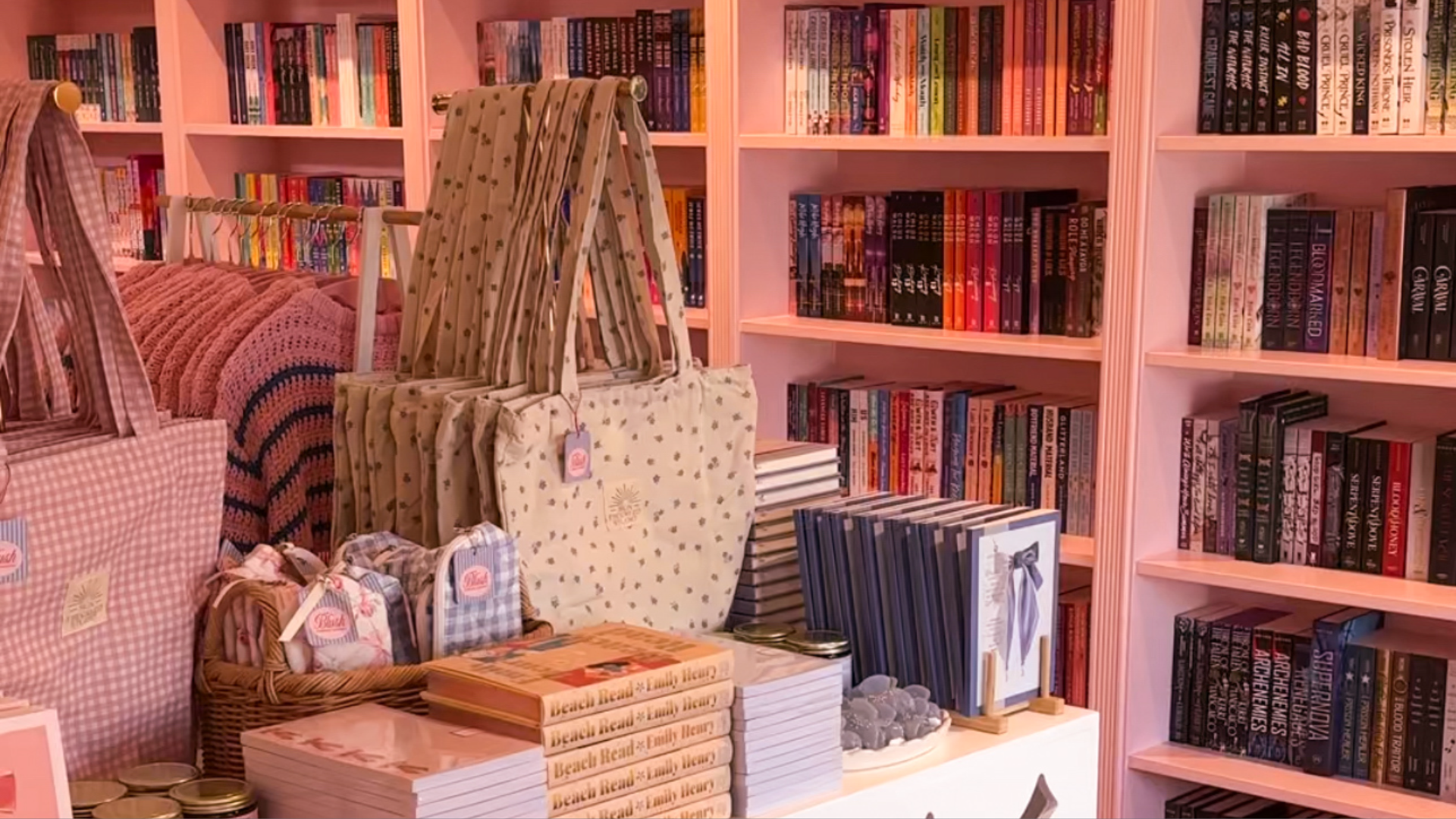 Books on shelves with a middle area for merch