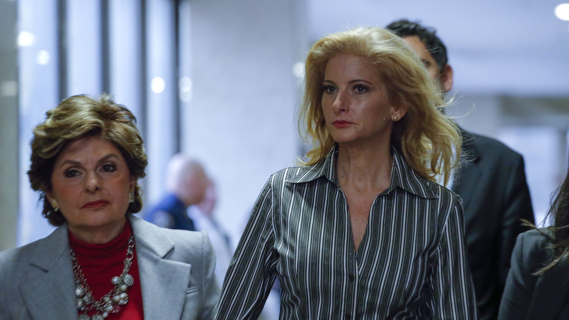   Summer Zervos, (R) a former contestant on "The Apprentice" arrives with lawyer Gloria Allred at the New York County Criminal Court on December 5, 2017, in New York. 