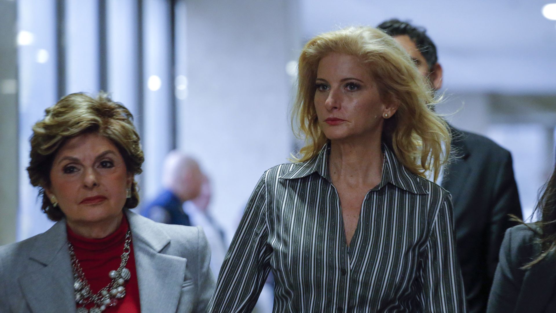 Summer Zervos, (R) a former contestant on "The Apprentice" arrives with lawyer Gloria Allred at the New York County Criminal Court on December 5, 2017, in New York.