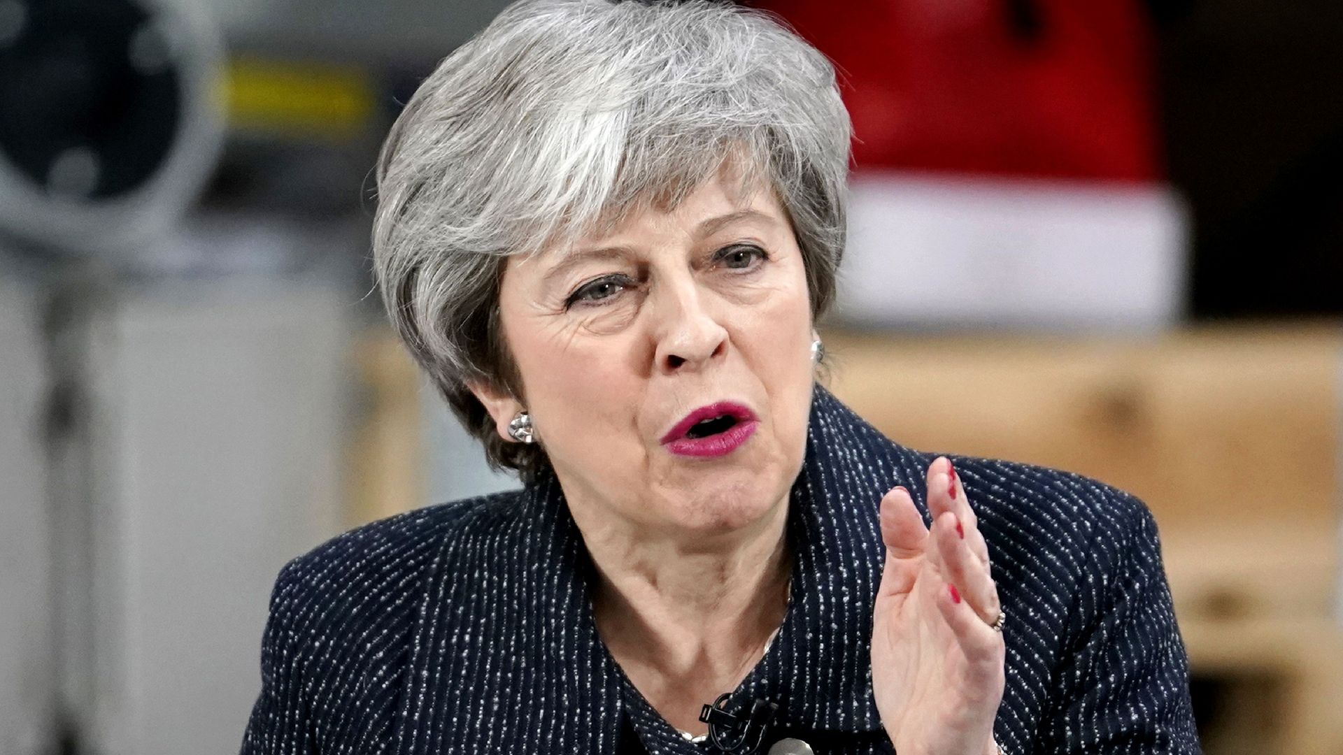 Theresa May at a podium