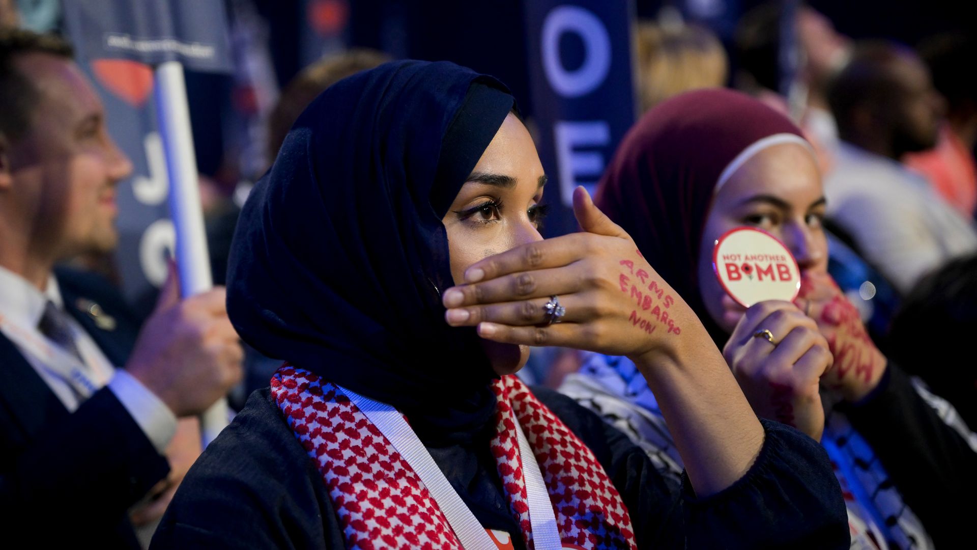 Minnesota delegates silent protest as US President Joe Biden, not pictured, speaks during the Democratic National Convention (DNC) at the United Center in Chicago, Illinois, US, on Monday, Aug. 19, 2024. 