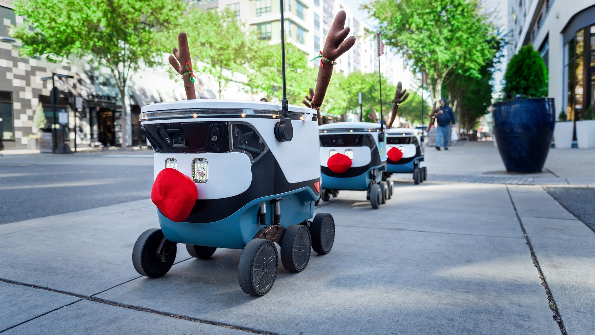 Uber Eats delivery robots dressed as reindeer with antlers and fuzzy red noses
