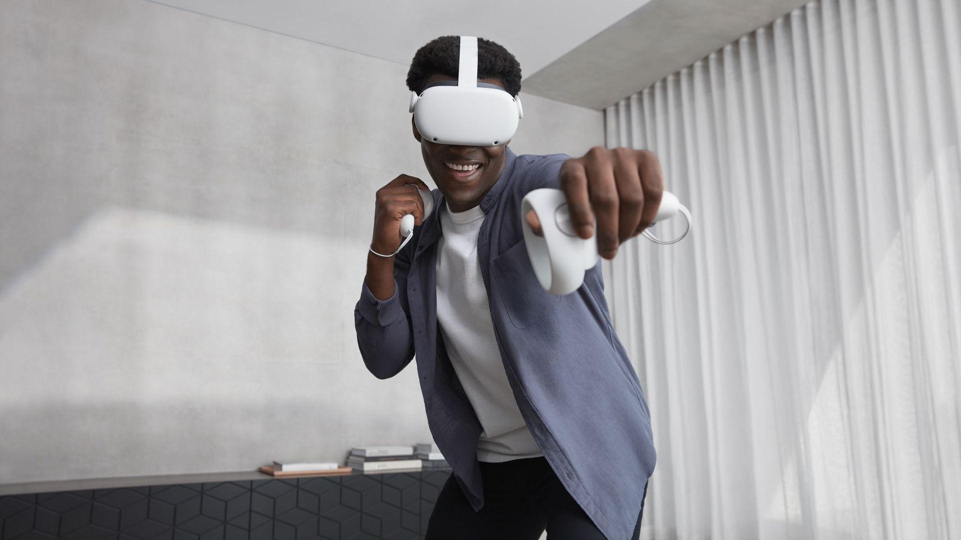 A young man using an Oculus Quest 2 VR headset
