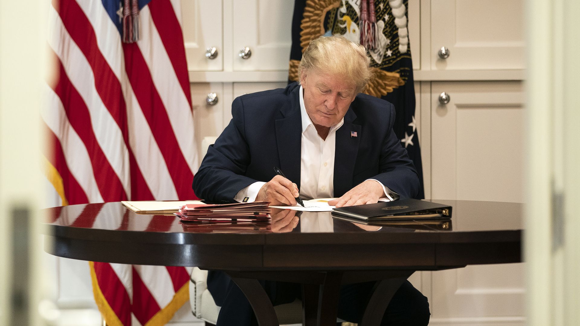 President Trump works in the Presidential Suite at Walter Reed National Military Medical Center in Bethesda, Md. Saturday, Oct. 3, 2020, after testing positive for COVID-19. 