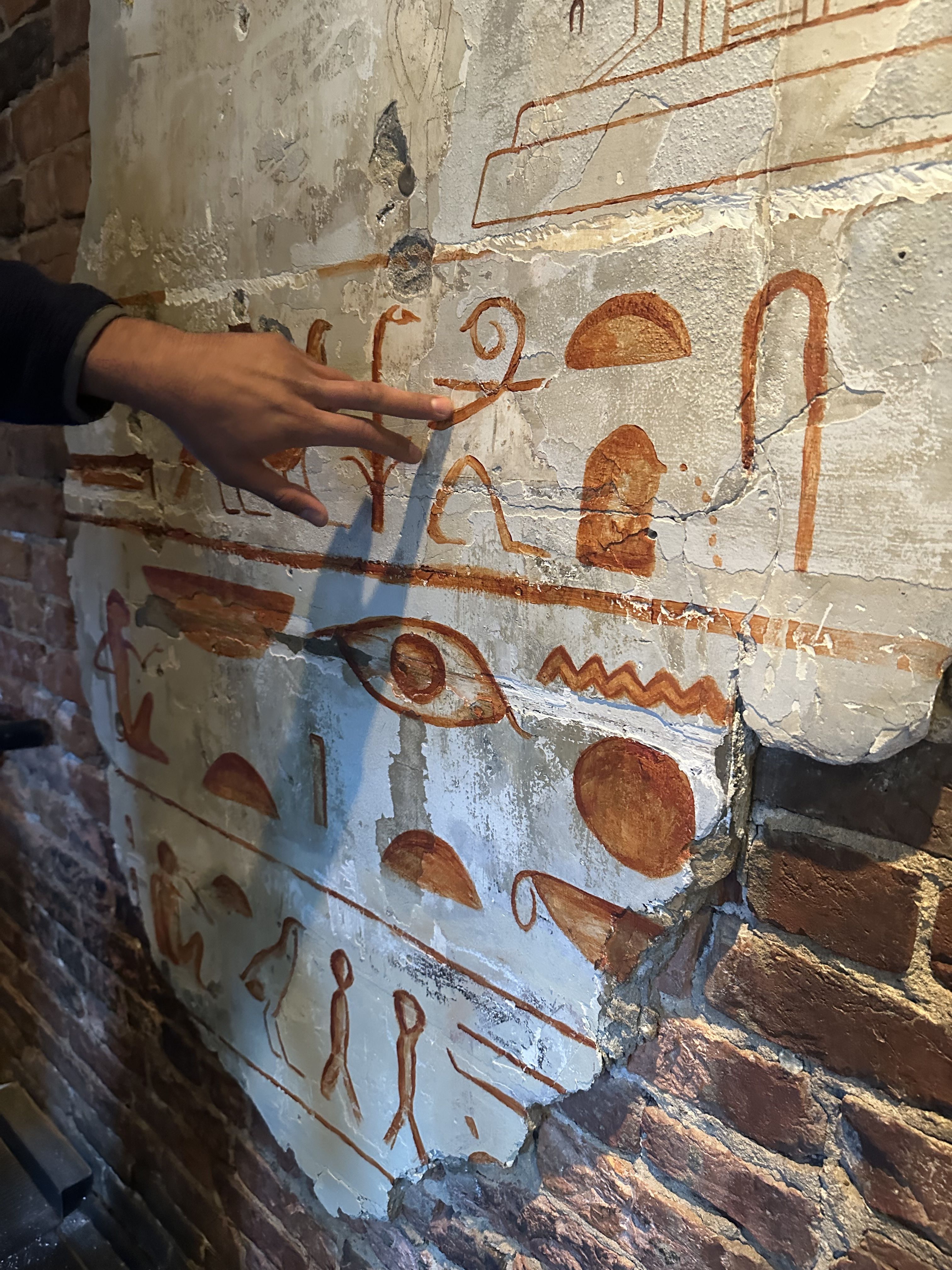 Orange hieroglyphics on the wall of the restaurant 