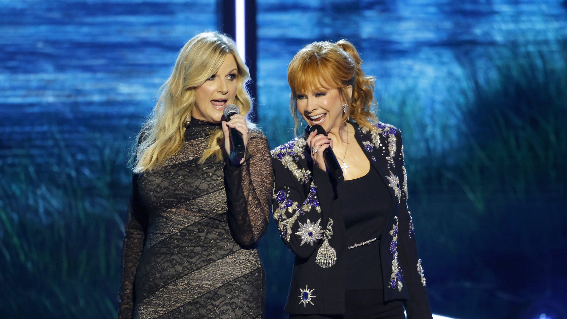 Trisha Yearwood and Reba McEntire perform onstage during Opry 100: A Live Celebration at Grand Ole Opry at the Ryman Auditorium on March 19, 2025 in Nashville, Tennessee.

