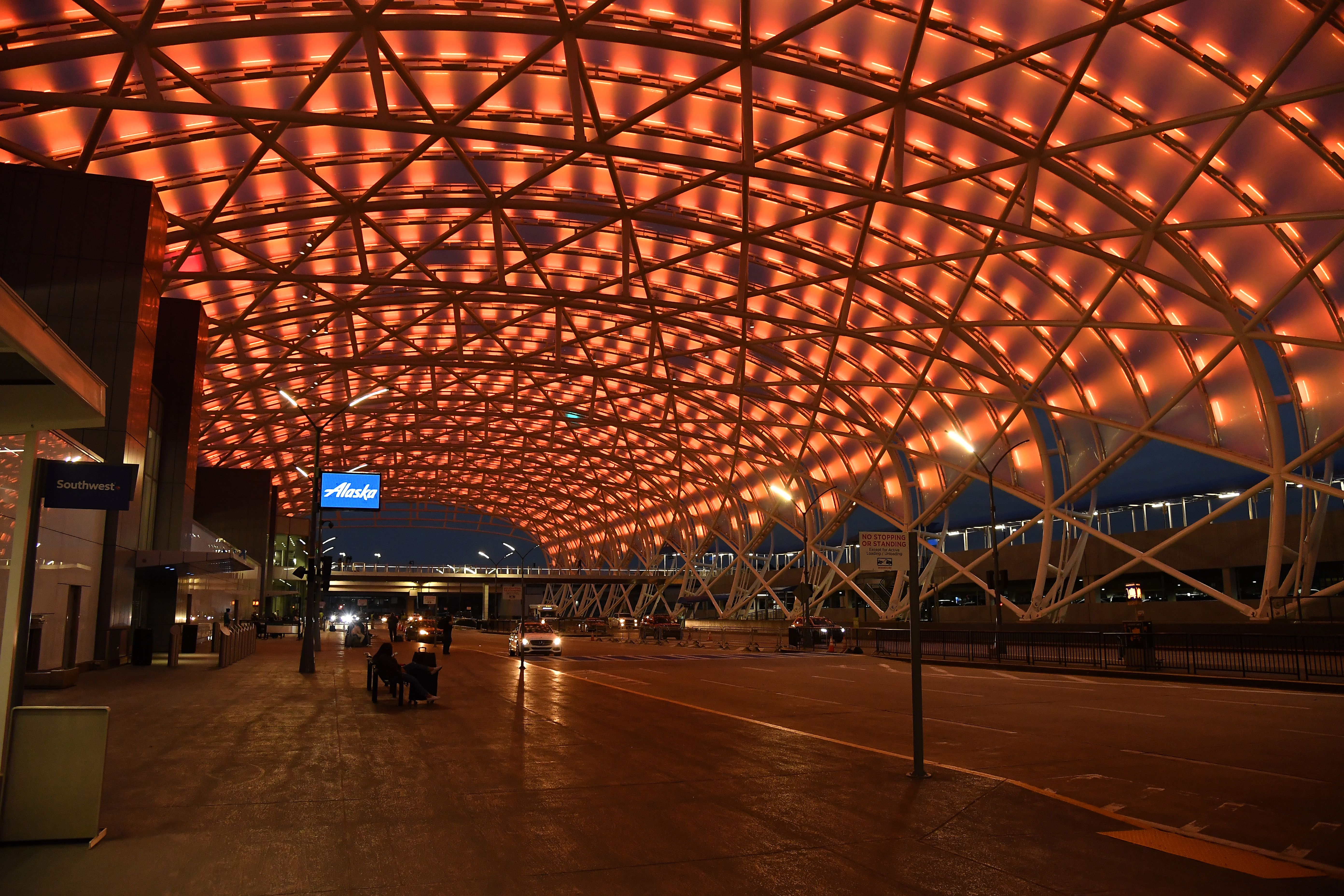 Hartsfield-Jackson Atlanta International Airport illuminates an amber hue to support the Biden Inaugural Committee's COVID-19 Memorial