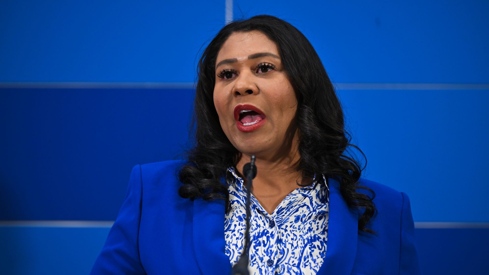 Photo of London Breed speak from a podium