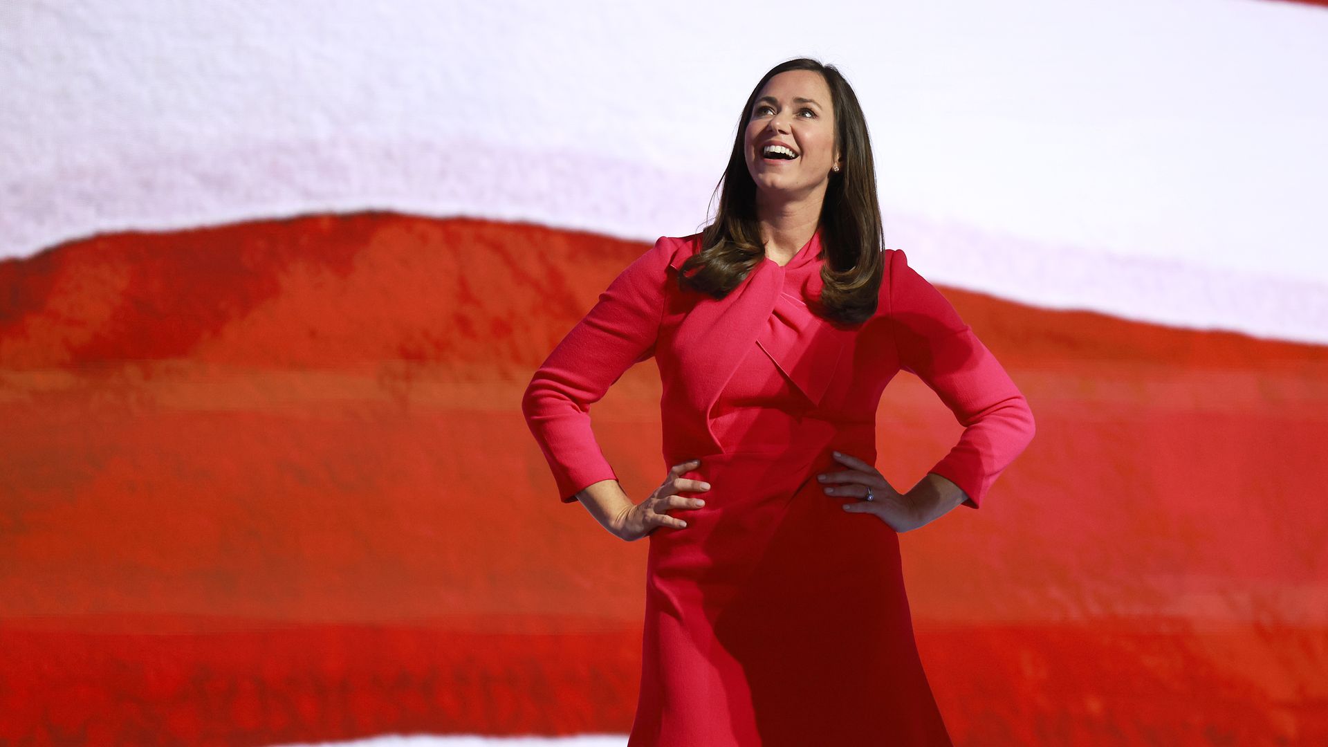 Katie Britt stands on the stage at the Republican National Convention.