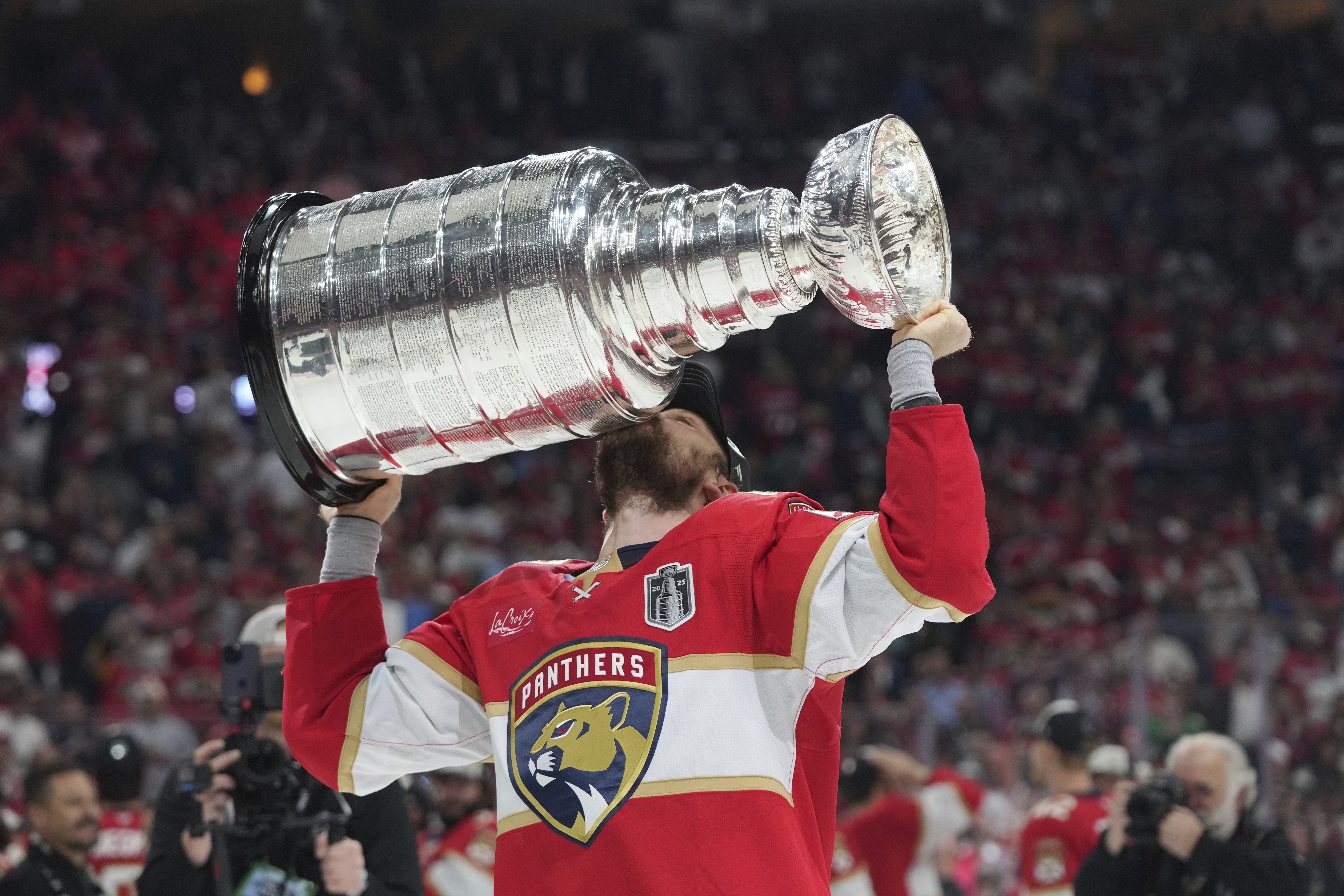 Florida Panthers center Sam Reinhart kisses the Stanley Cup after defeating the Edmonton Oilers last night.