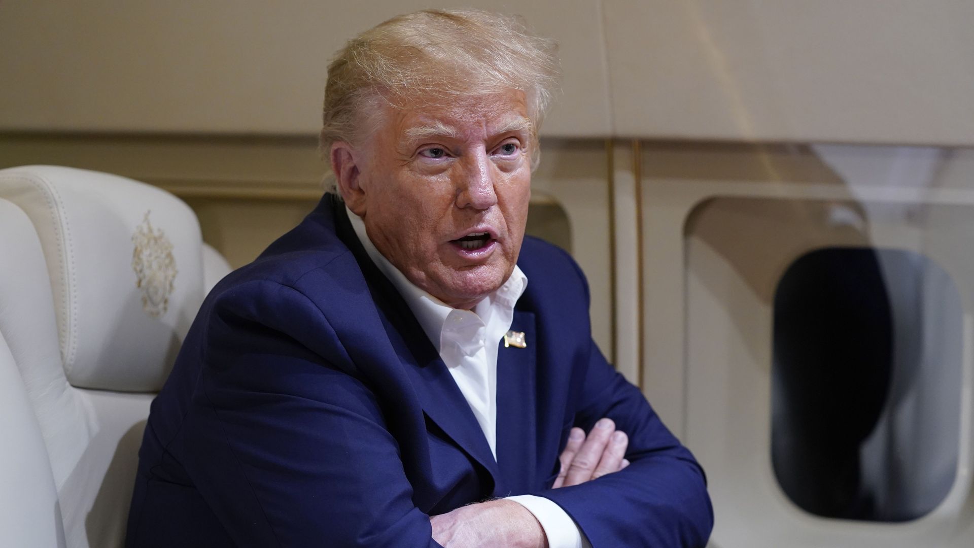 Former President Trump talks with reporters Saturday on his plane en route to West Palm Beach, Fla., after a campaign rally in Waco, Texas.