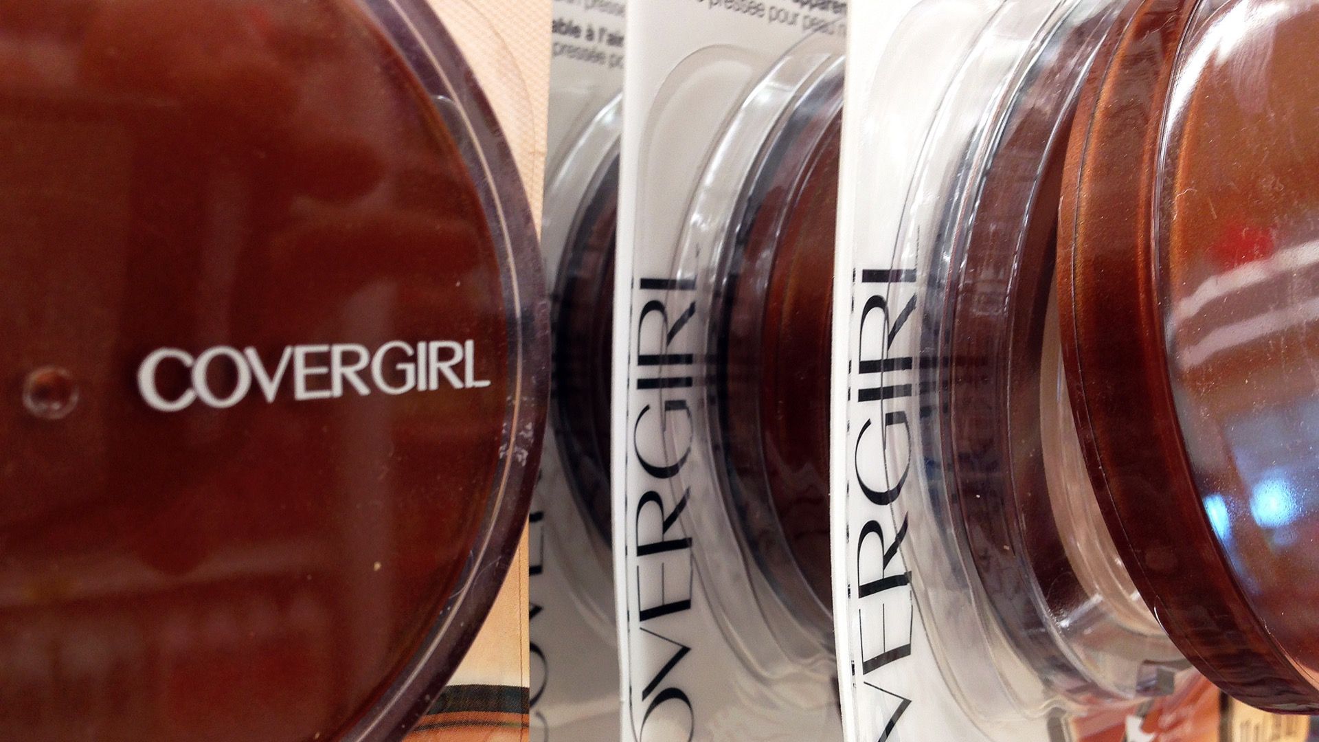 Covergirl makeup is displayed in a shopping aisle