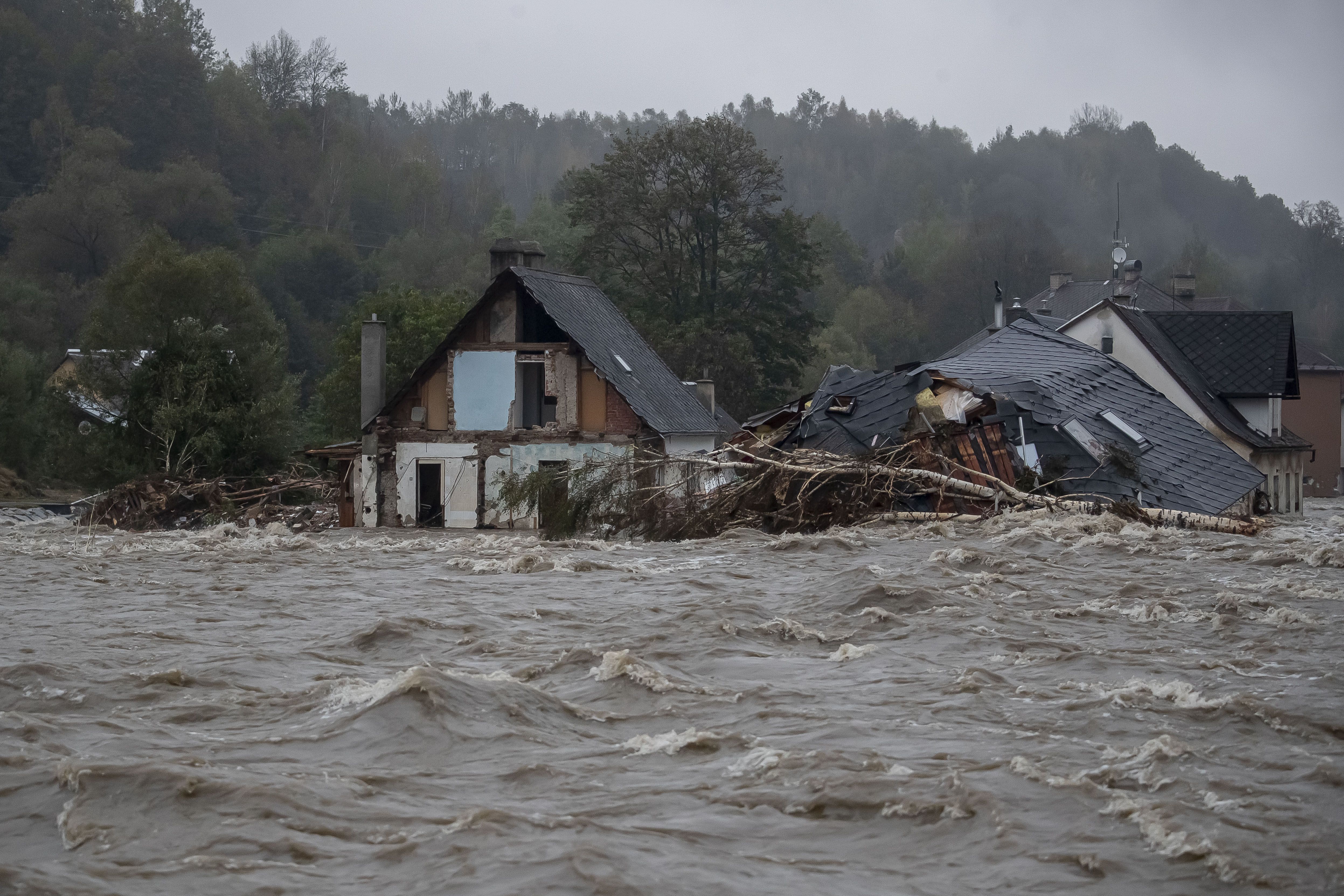 Properties are damaged as floodwaters rise following heavy rain on September 15, 2024 in Jesenik, Czech Republic