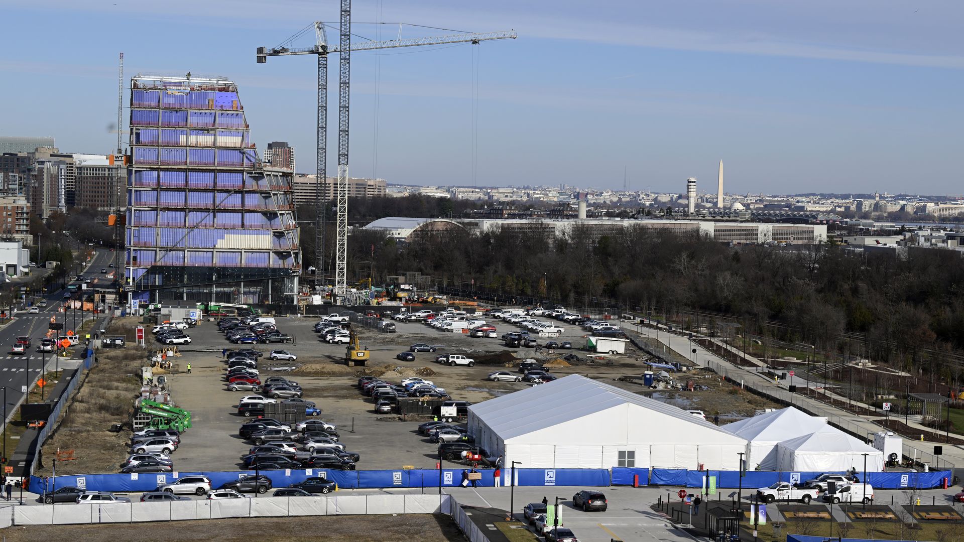 An image of the future Virginia Tech Innovation Campus under construction, with cranes.