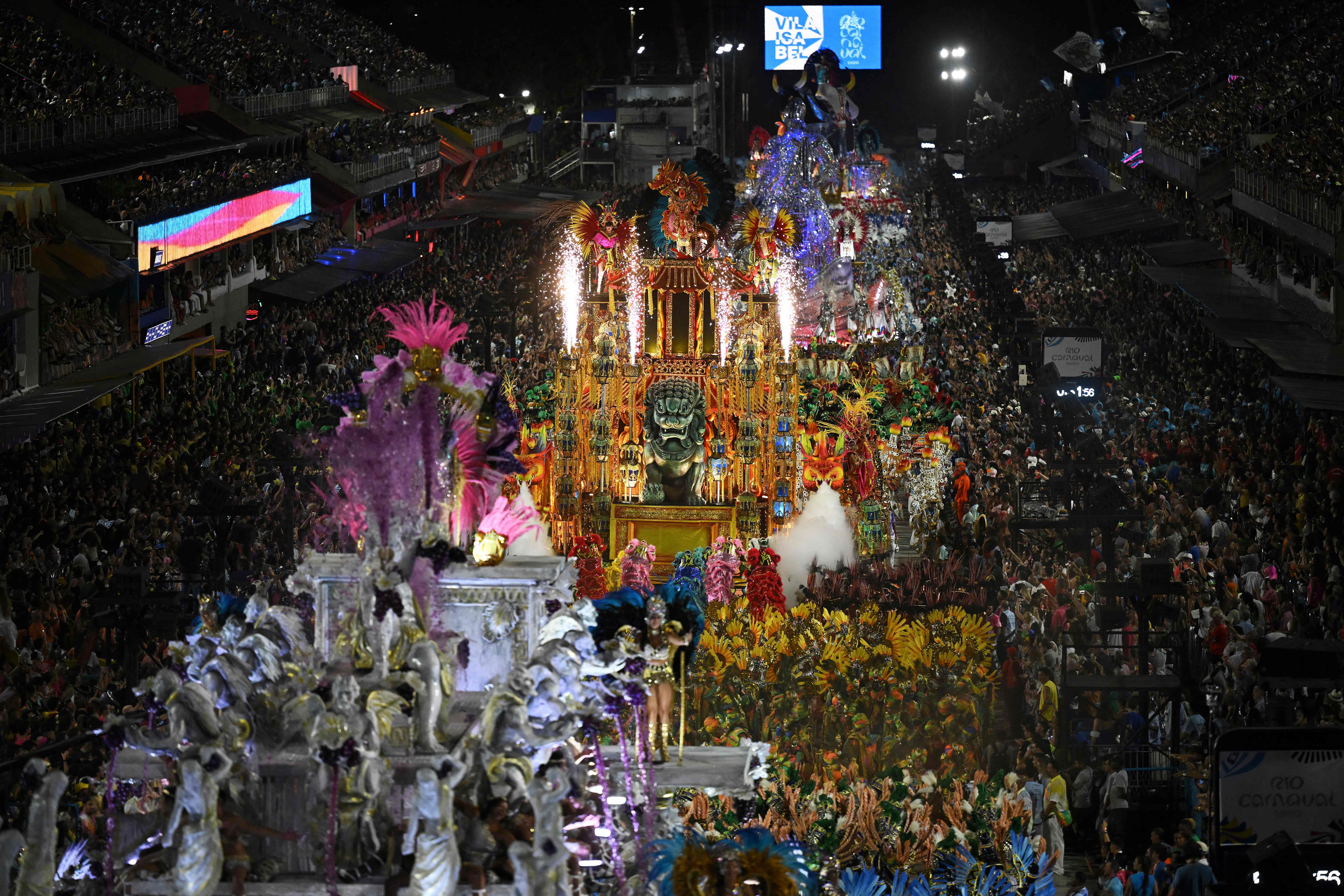 Several colorful floats are shown from above during Brazil's carnival parade