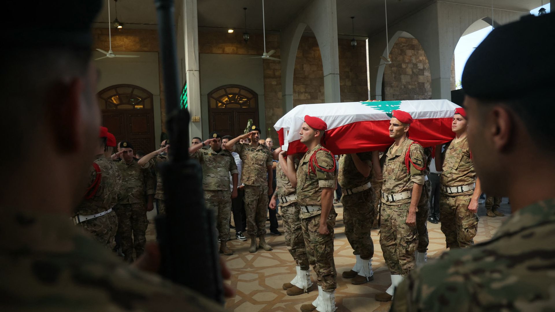 Lebanese soldiers carry a flag-draped coffin during the funeral procession for Brig. Gen. Wissam Sabra in Beirut. Sabra was killed in an Israeli strike in southern Lebanon on June 6.