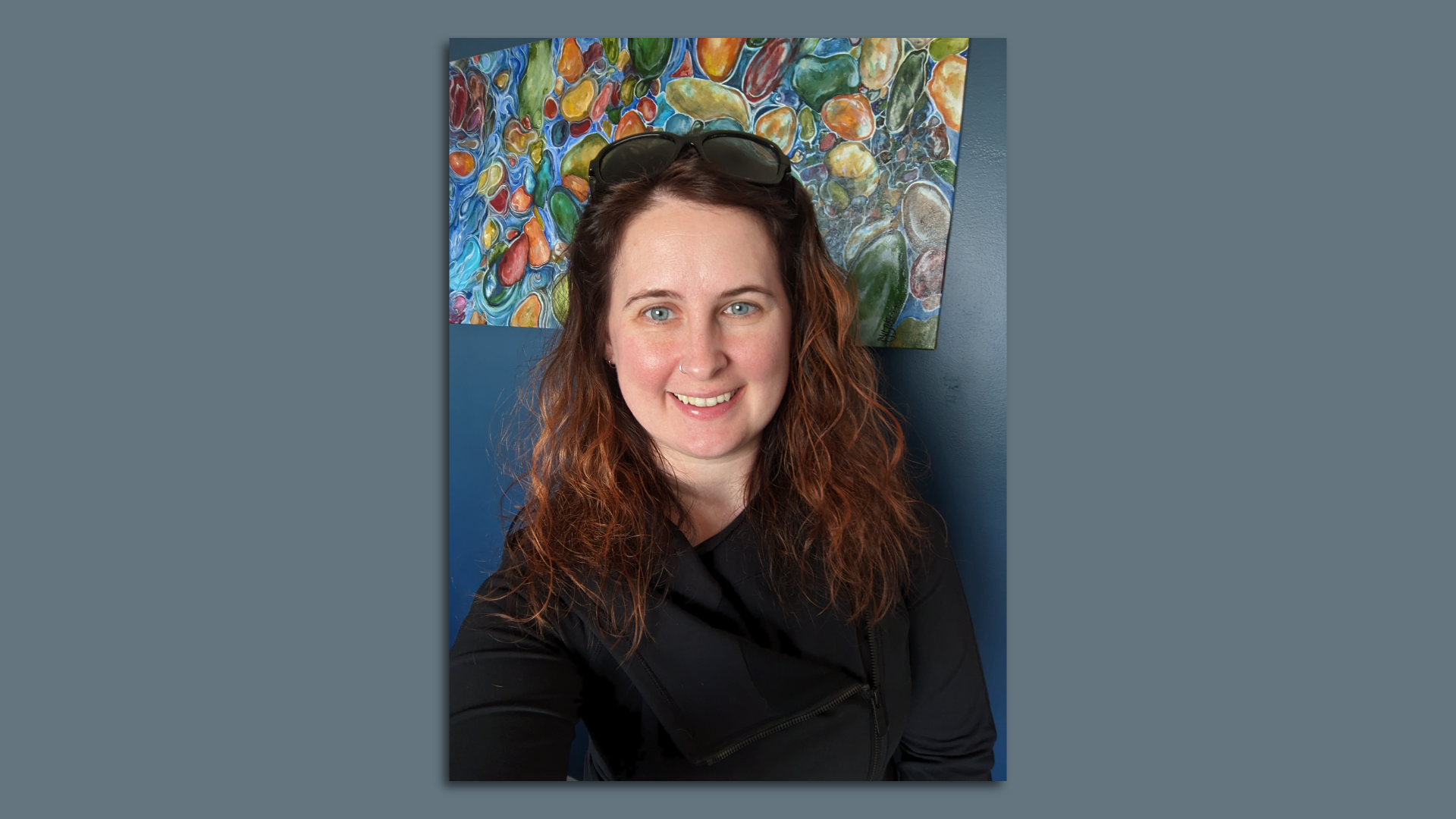 Jena Best in front of a wall