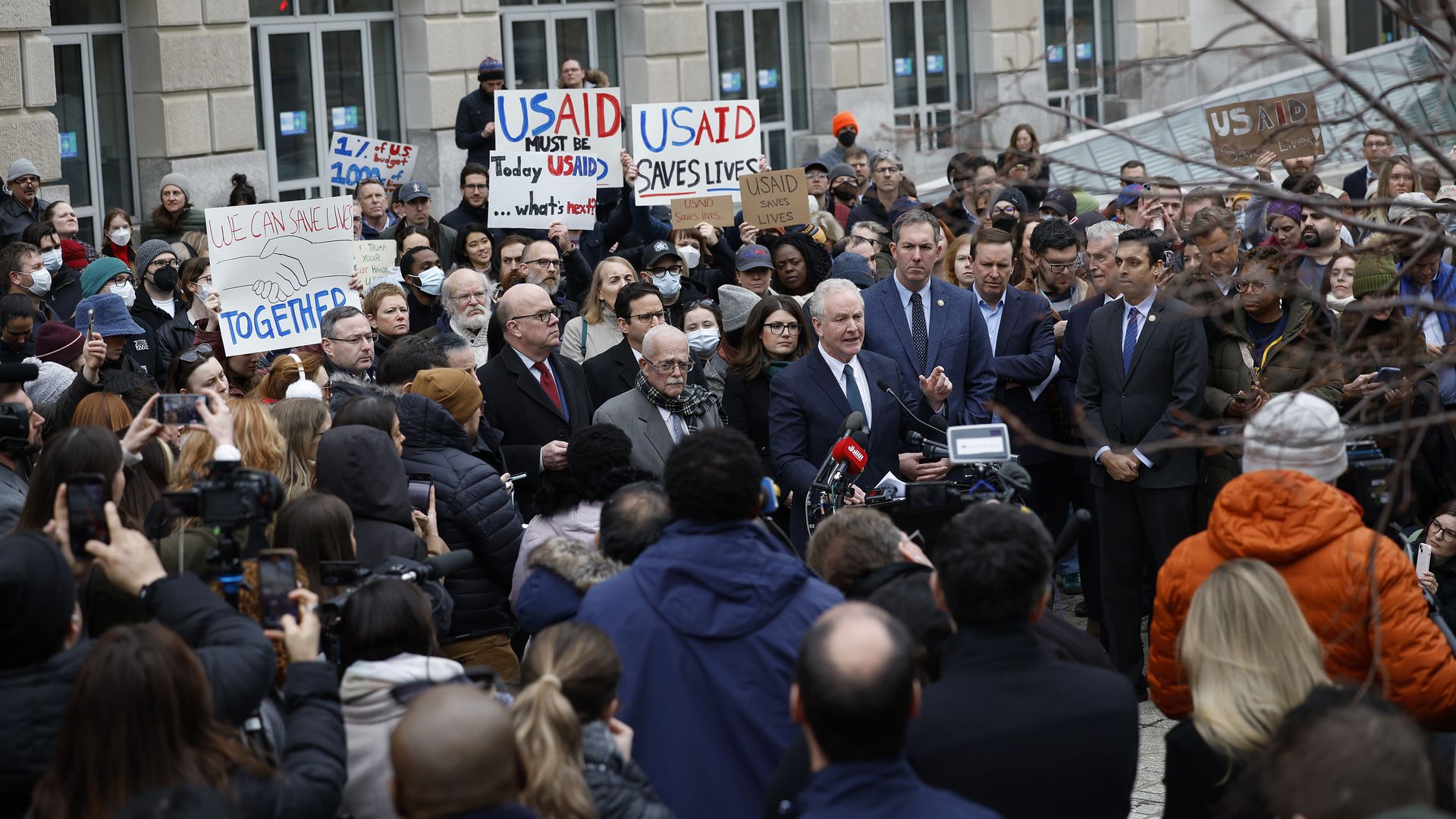  Sen. Chris Van Hollen (D-MD) and Rep. Gerry Connolly (R-VA), joined by fellow lawmakers and employees and supporters of U.S. Agency for International Development (USAID) speak at a press conference outside of USAID headquarters on February 03, 2025 in Washington, DC. 