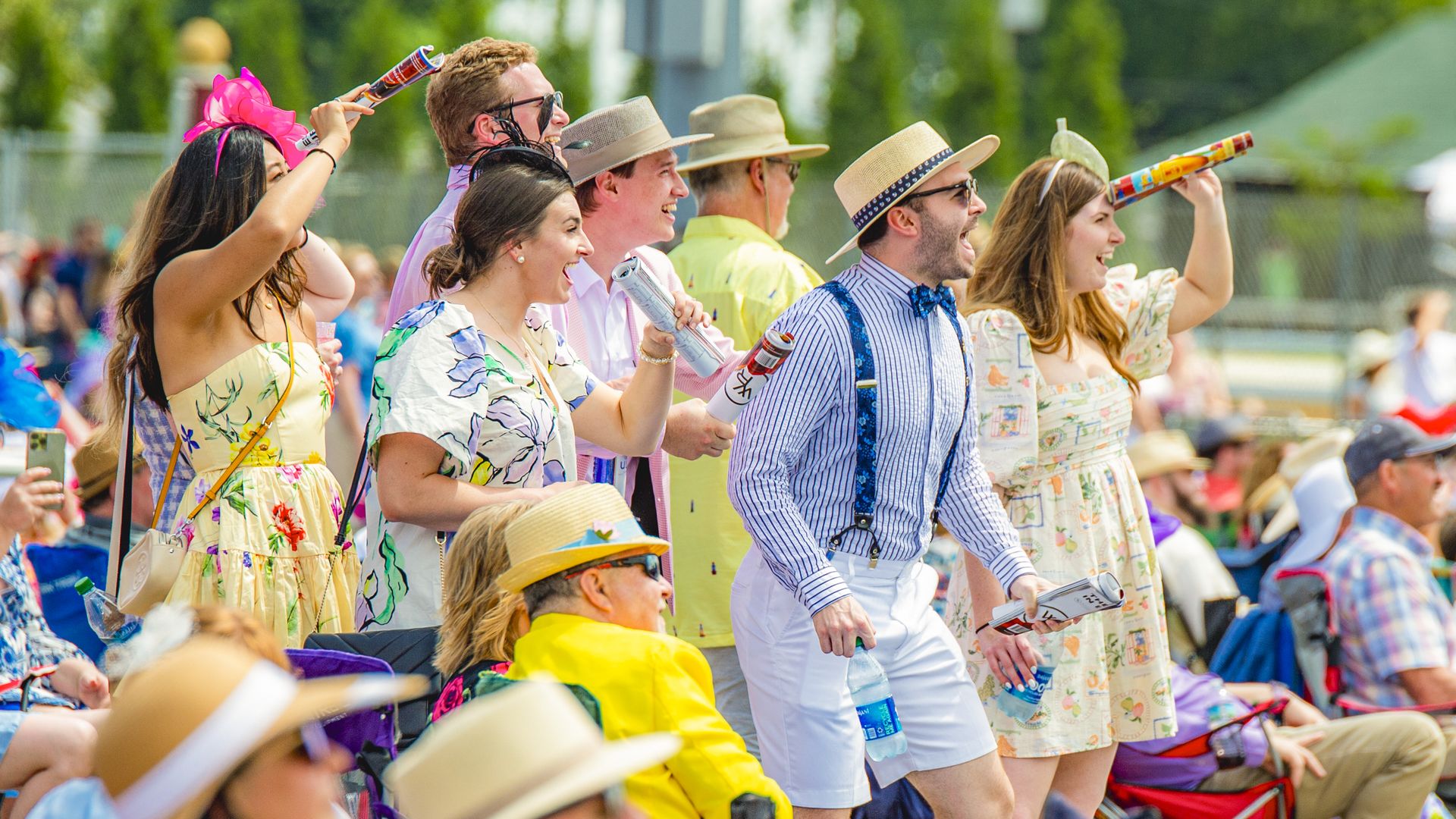 a crowd of youngish white people dressed in  colorful derby clothes 
