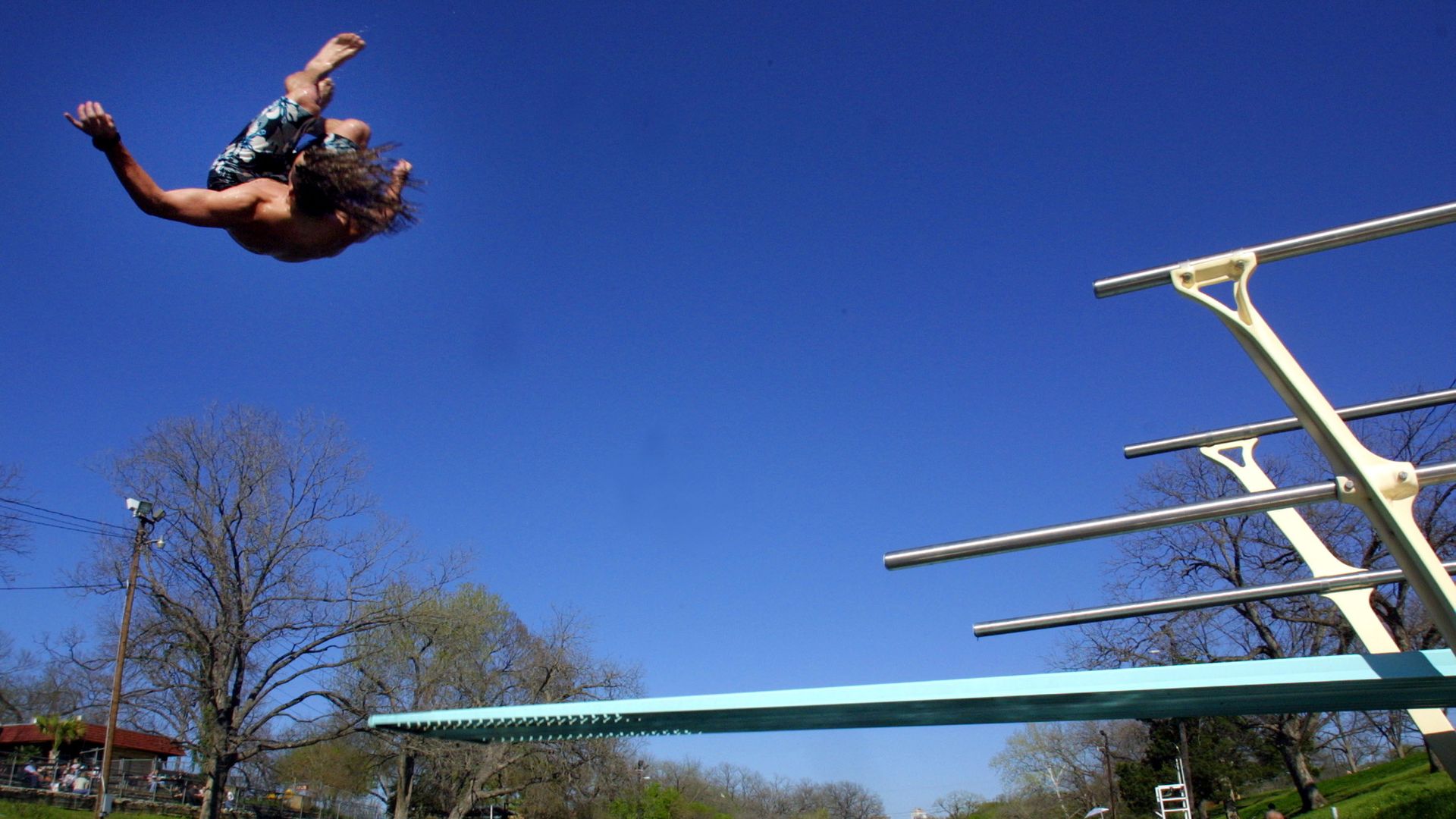 A diver in Barton Springs pool