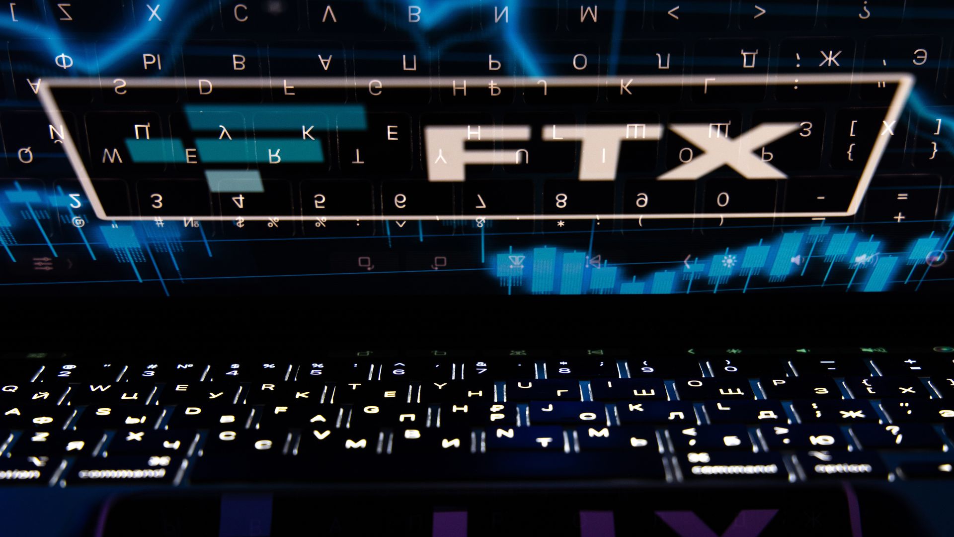 The FTX Cryptocurrency Derivatives Exchange logo on a laptop screen.