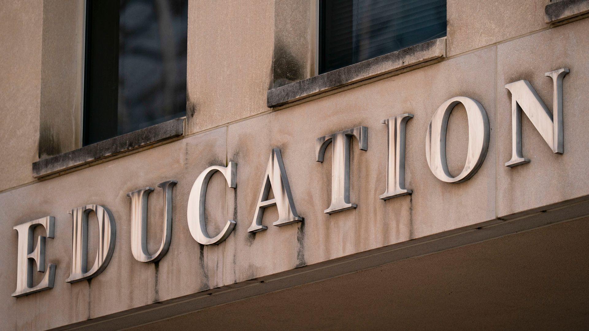 A sign reads "EDUCATION" 