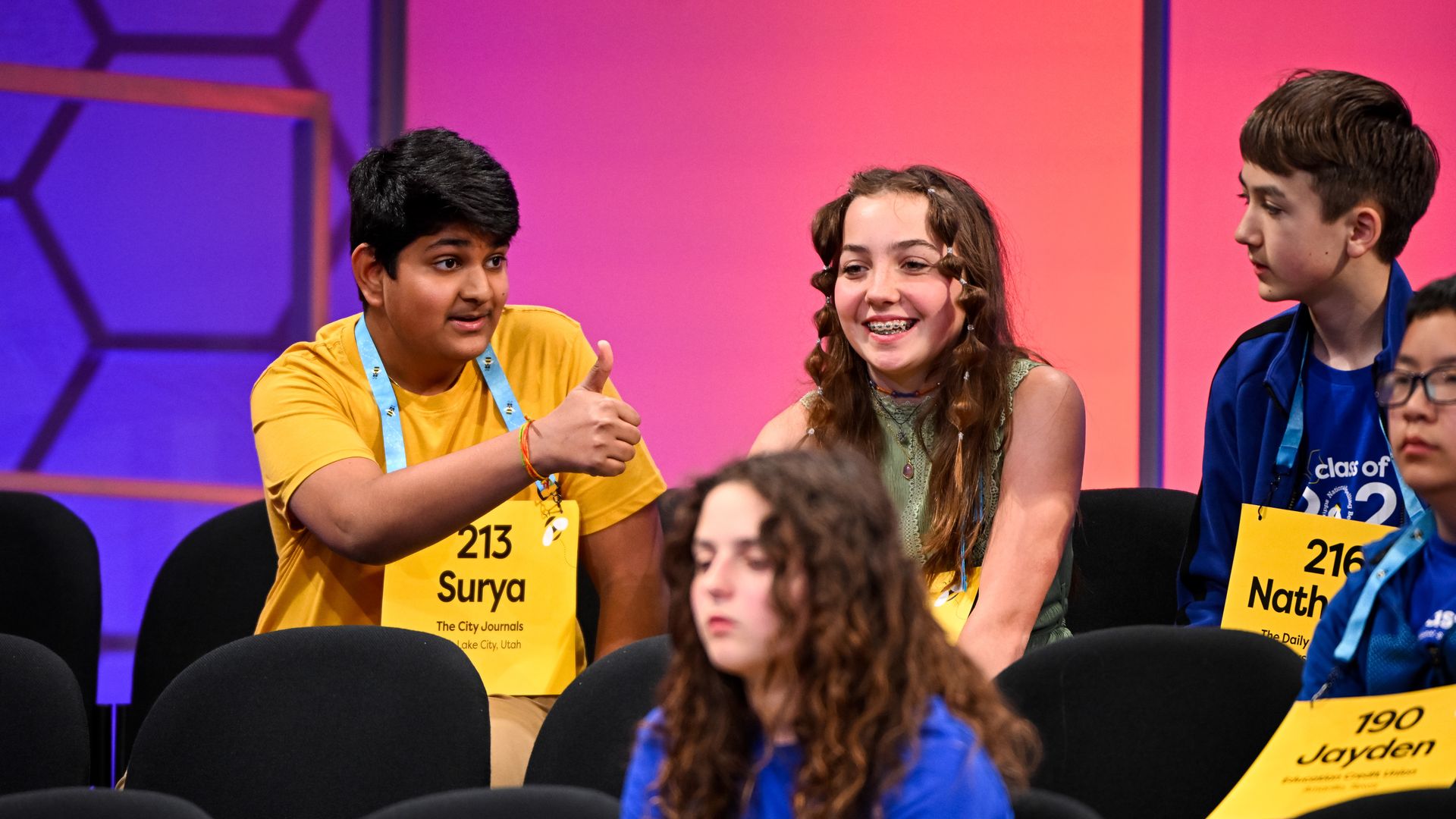 Surya Kapu gives a thumbs up to competitors at the Scripps National Spelling Bee. Photo: E. M. Pio Roda / Scripps National Spelling Bee