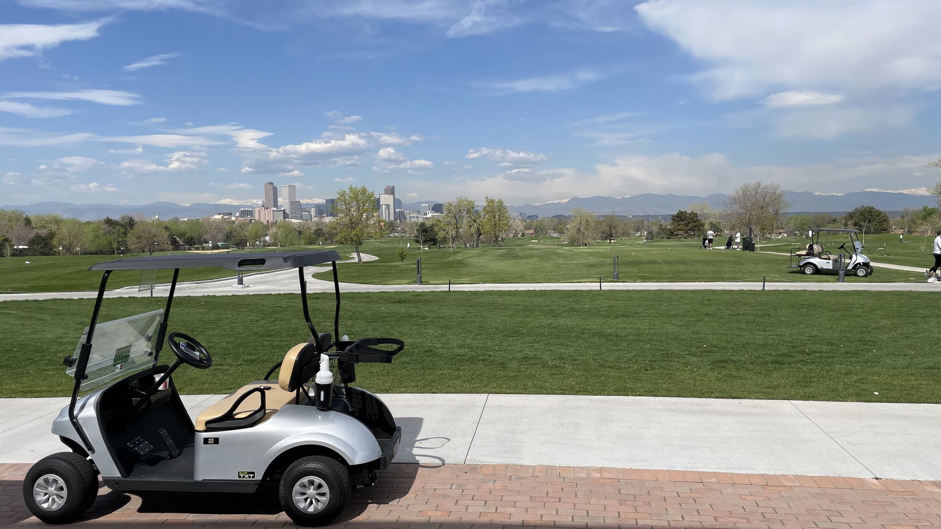 The city skyline and mountains are visible on much of the City Park Golf Course. 