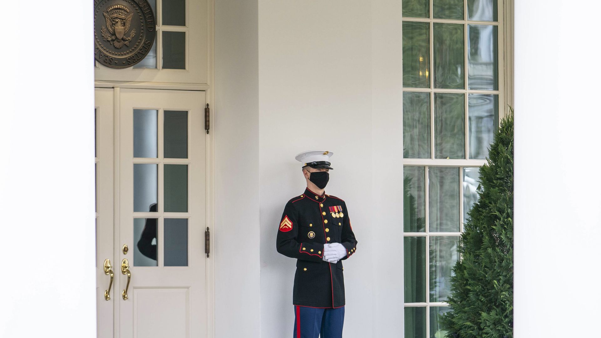 A Marine sentry is seen standing post outside the entrance to the West Wing.