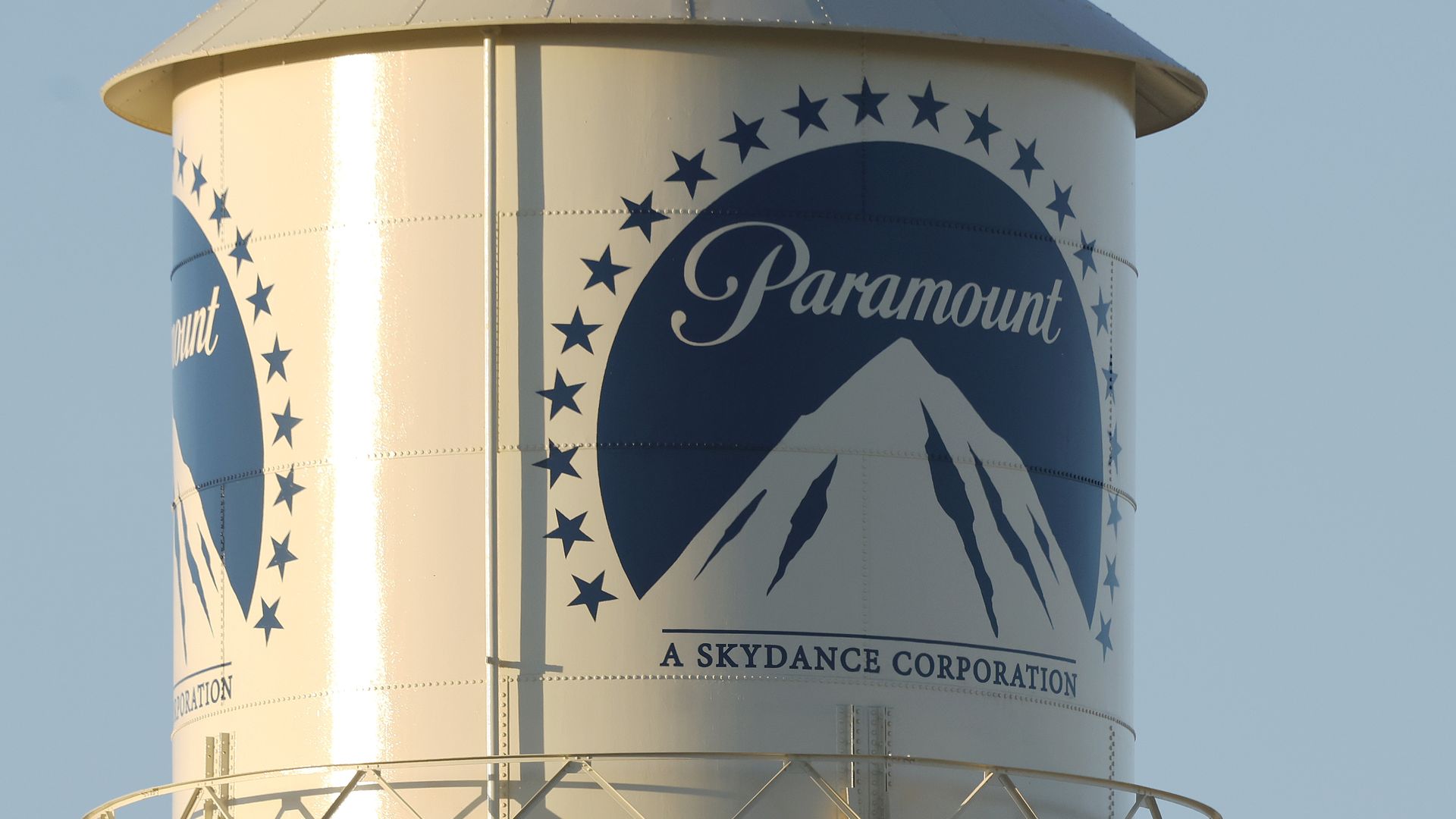 A water tower with the Paramount Pictures logo, a mountain surrounded by stars.