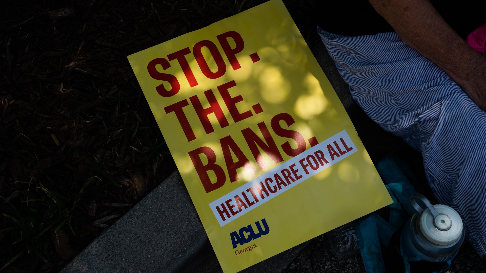 Photo of a sign that sats "stop the bans"