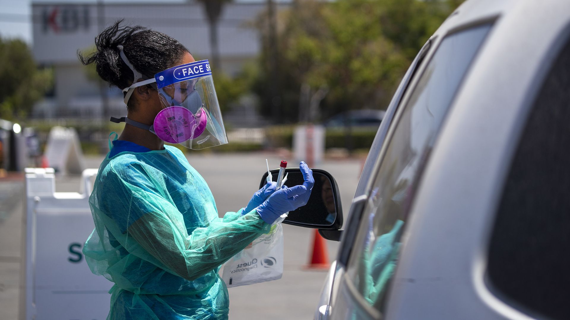 Maritza Perez, a registered nurse, gives a COVID-19 test at AltaMed Health Services in Anaheim on Thursday, July 9