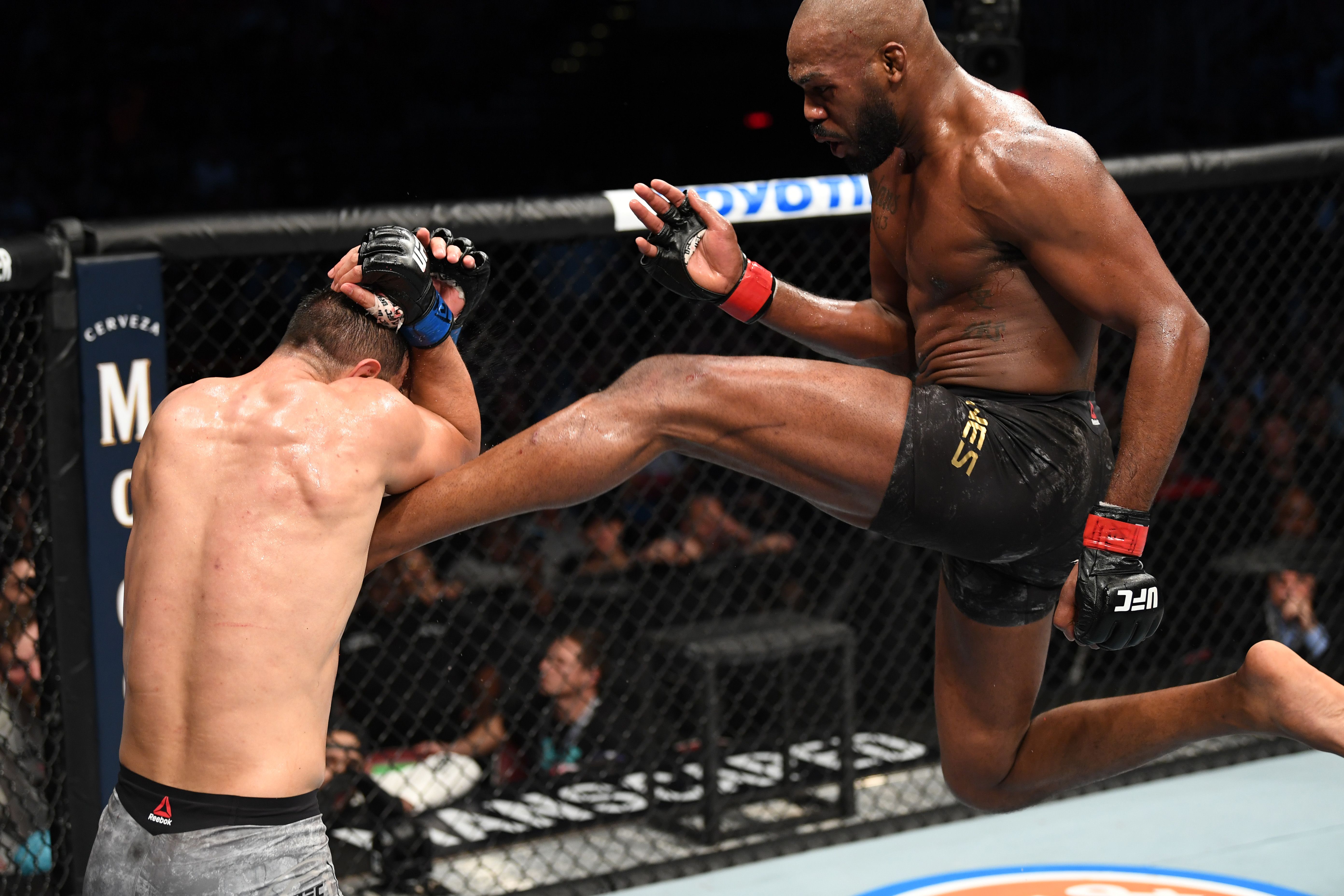 Jon Jones kicking Dominick Reyes