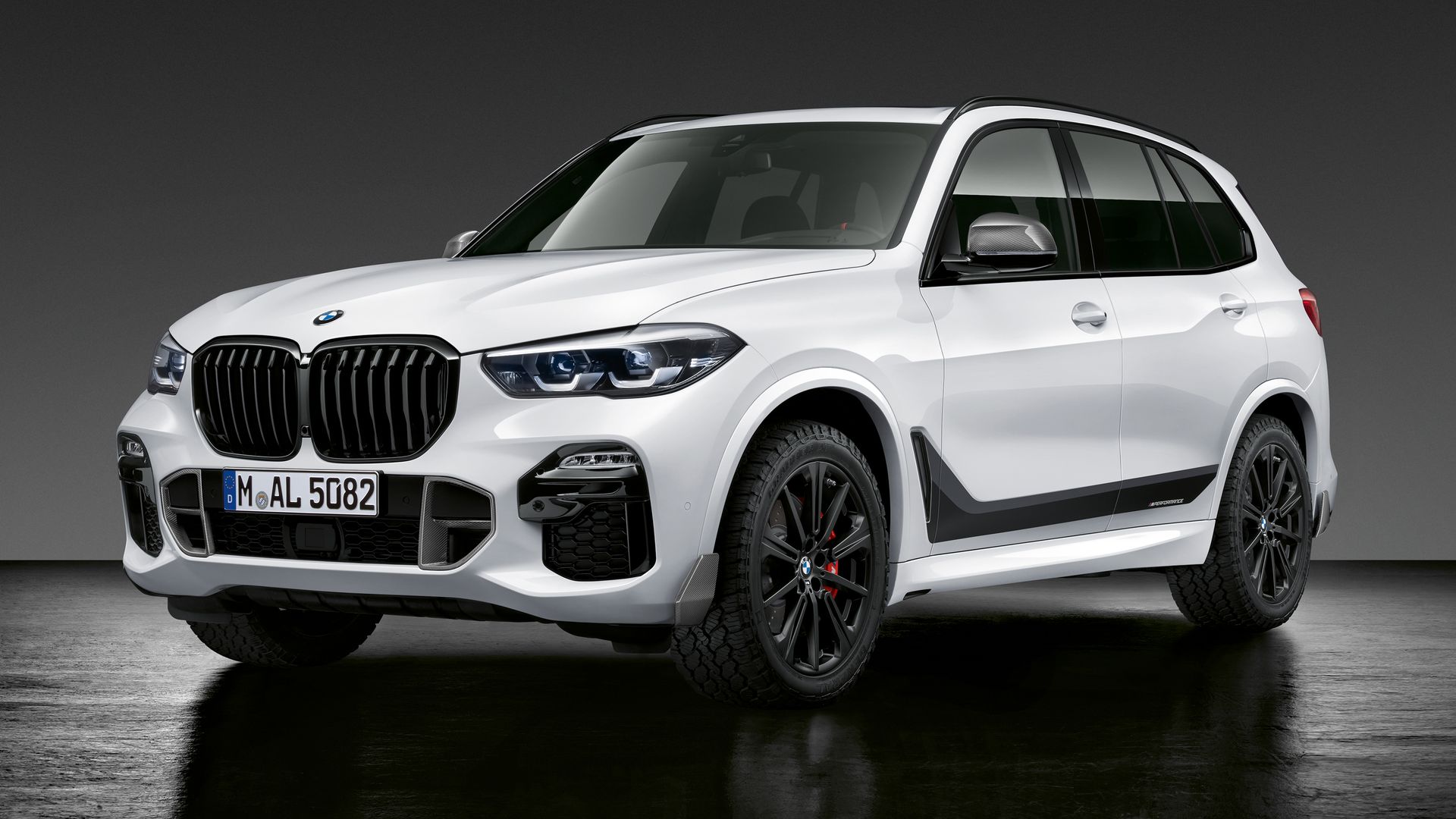 Image of white BMW X5 M50i sport utility vehicle