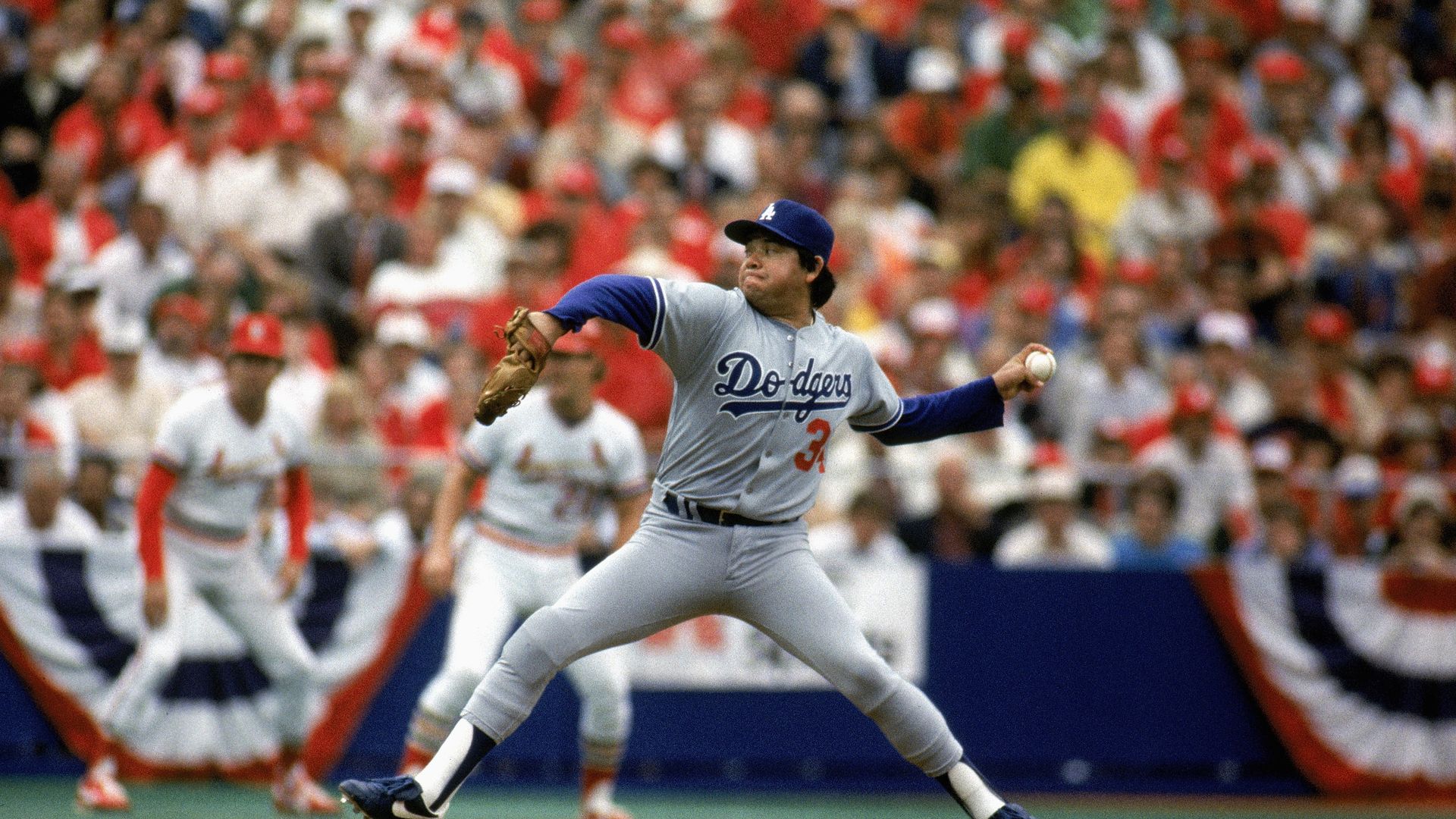 Dodgers pitcher Fernando Valenzuela throws a ball during a game.